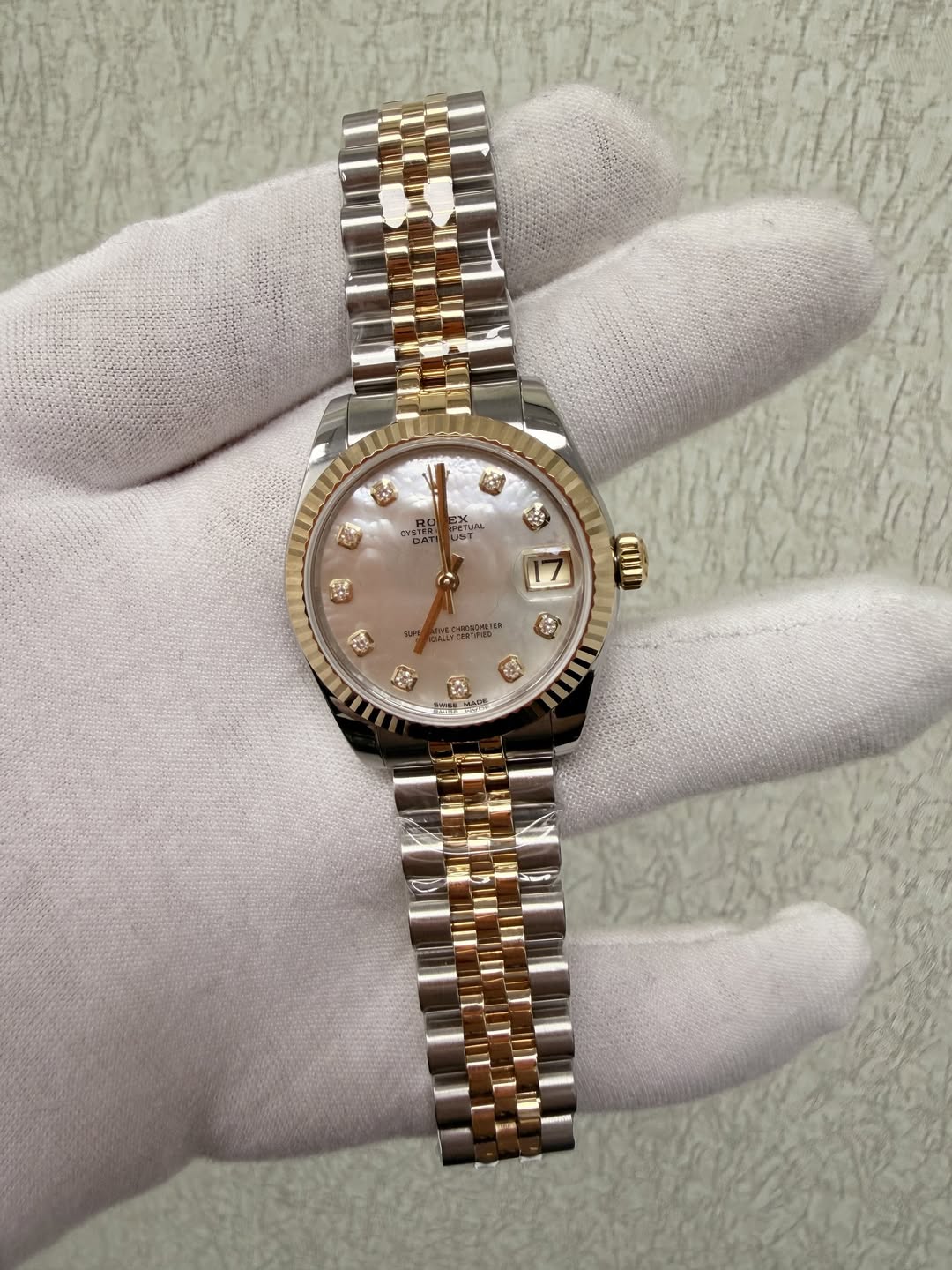 May be an image of wrist watch and text