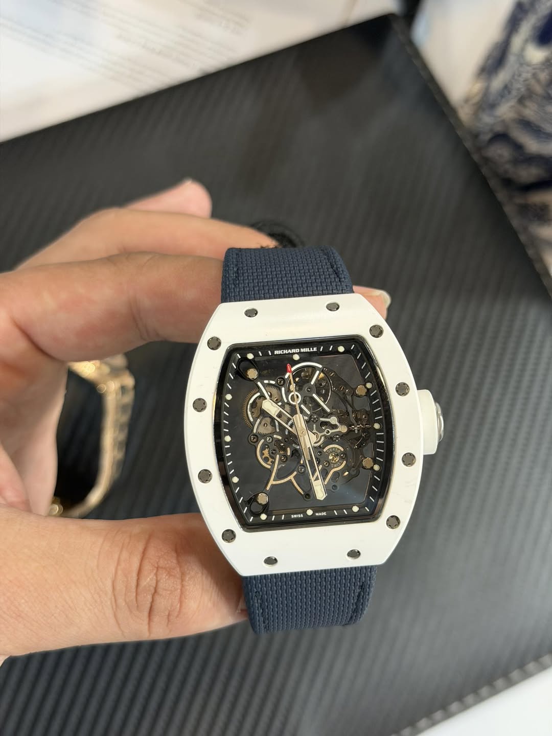 May be an image of wrist watch and text
