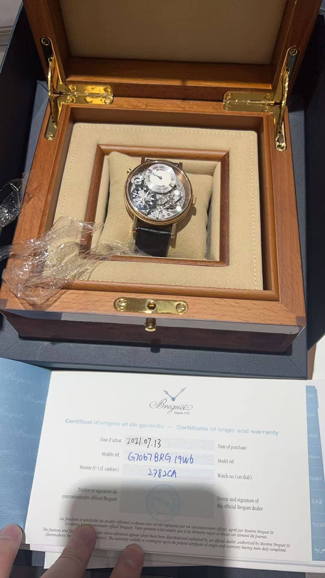 May be an image of wrist watch and text