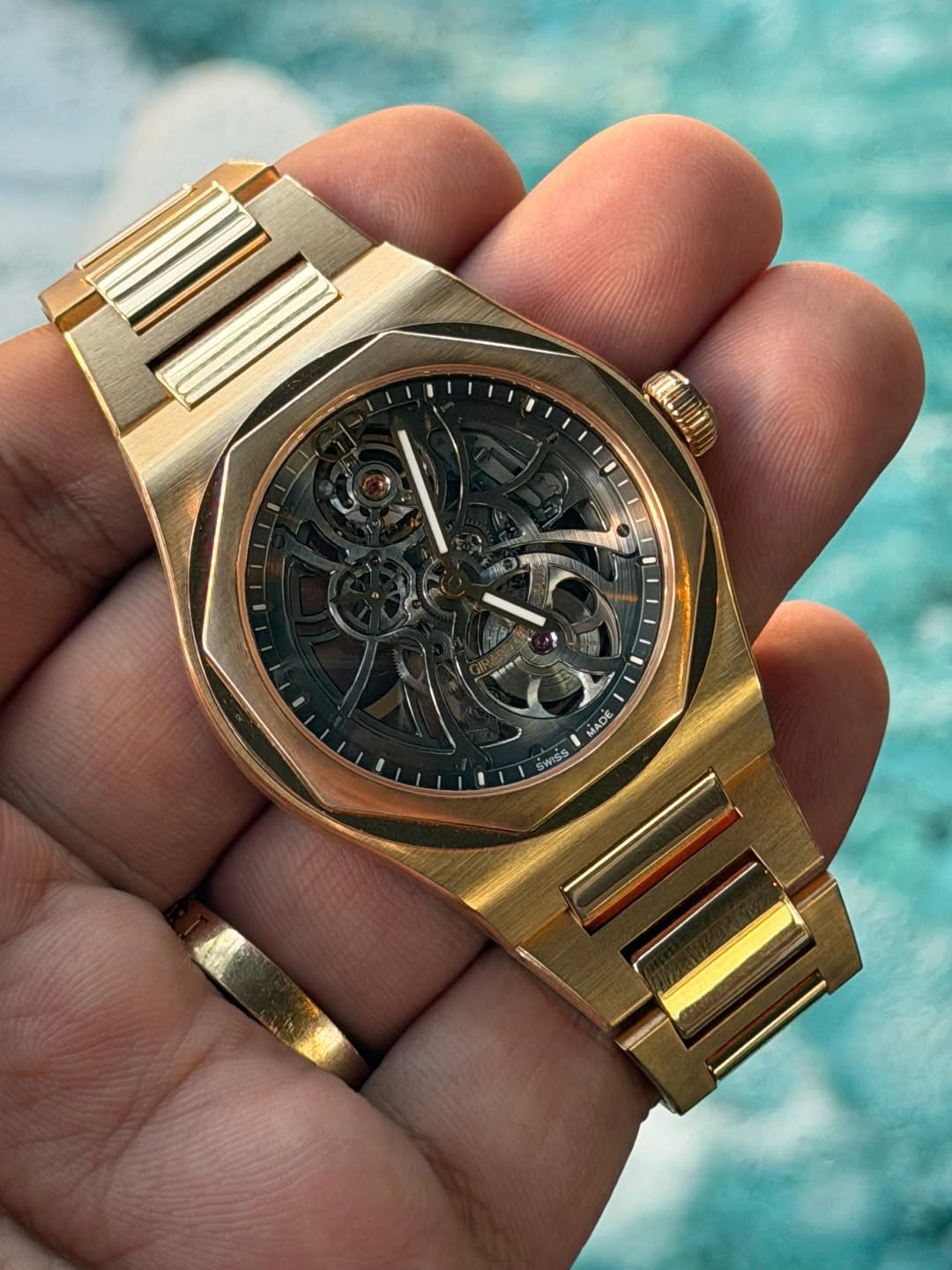 May be an image of wrist watch and text