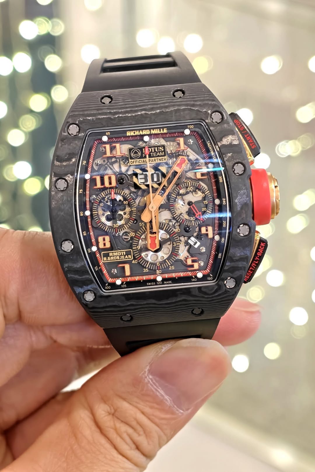 May be an image of wrist watch and text
