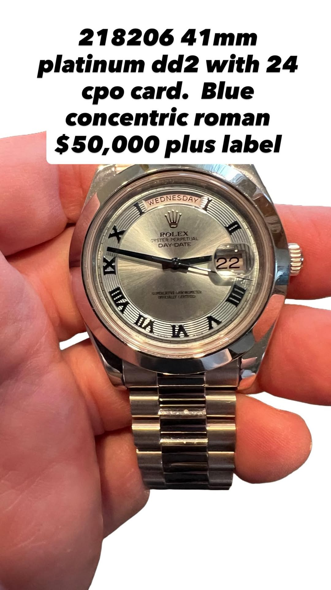 May be an image of wrist watch and text that says '218206 41mm platinum dd2 with 24 cpo card. concentric roman $50,000 o00 plus label WEDNESDAY WI RO OYSTER OE DA X 3'