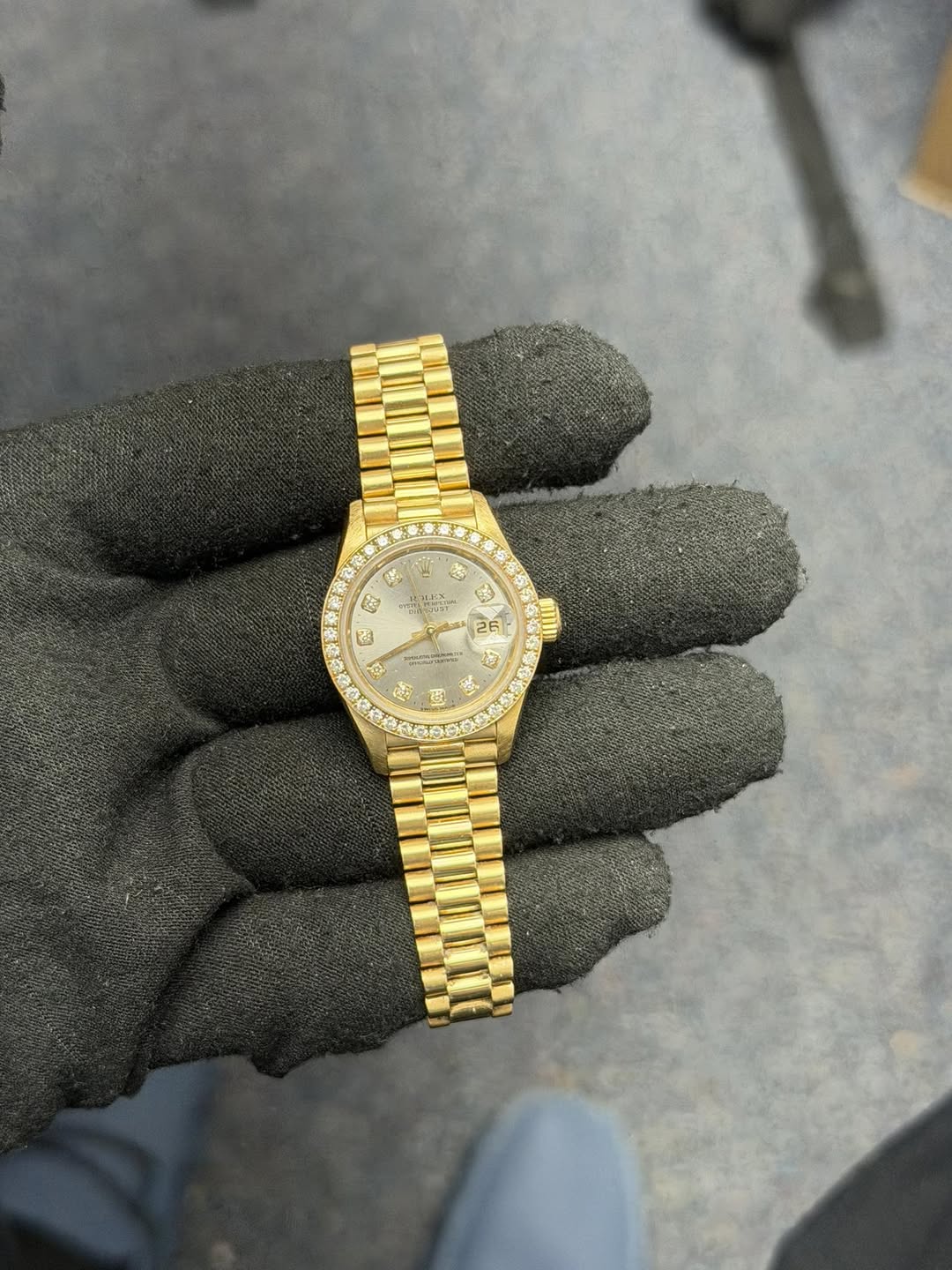 May be an image of wrist watch and text