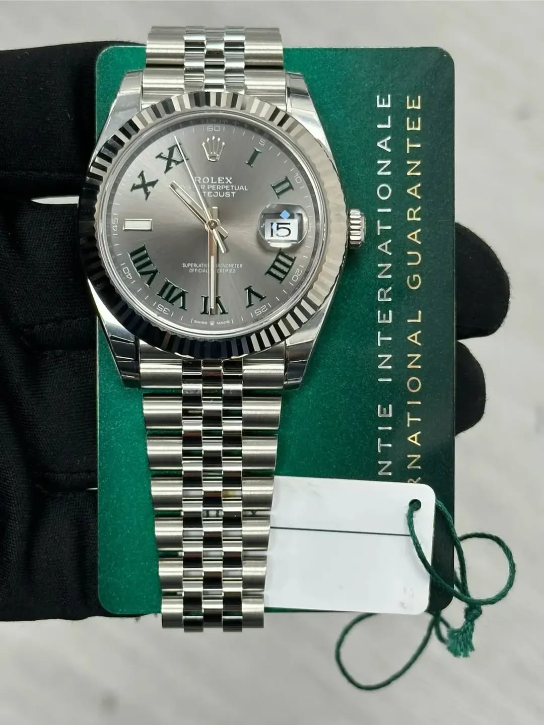 May be an image of wrist watch and text that says '60 5 ROLEX PEDOR UAL LEX ESUT EJUS RPERPET X X 45 40 RUPERLATN DEFICIAL PEEA CRIIFES SE saga MADE) 25 2s 10 15 UUD INTERNATI TL…