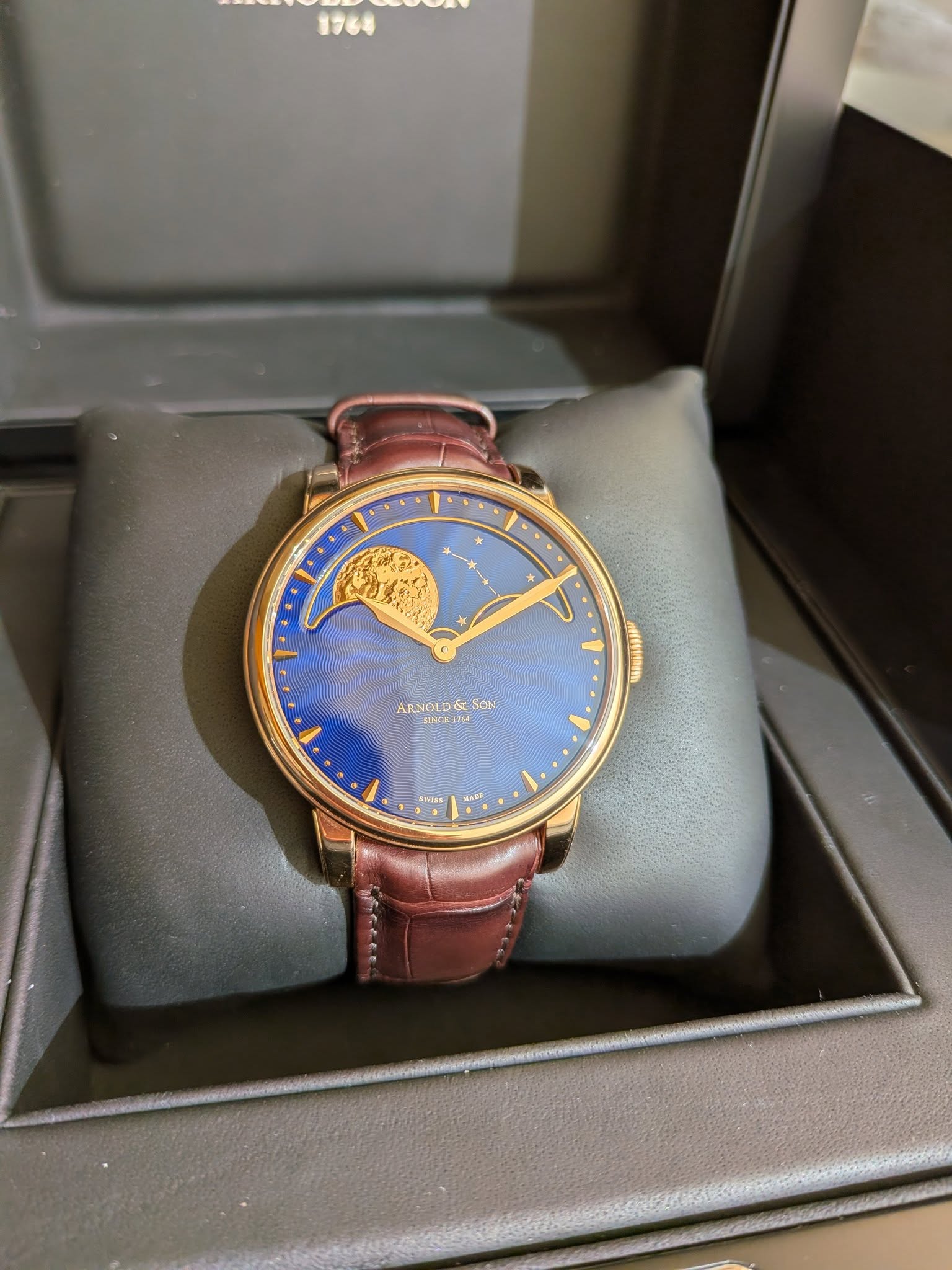 May be an image of wrist watch and text