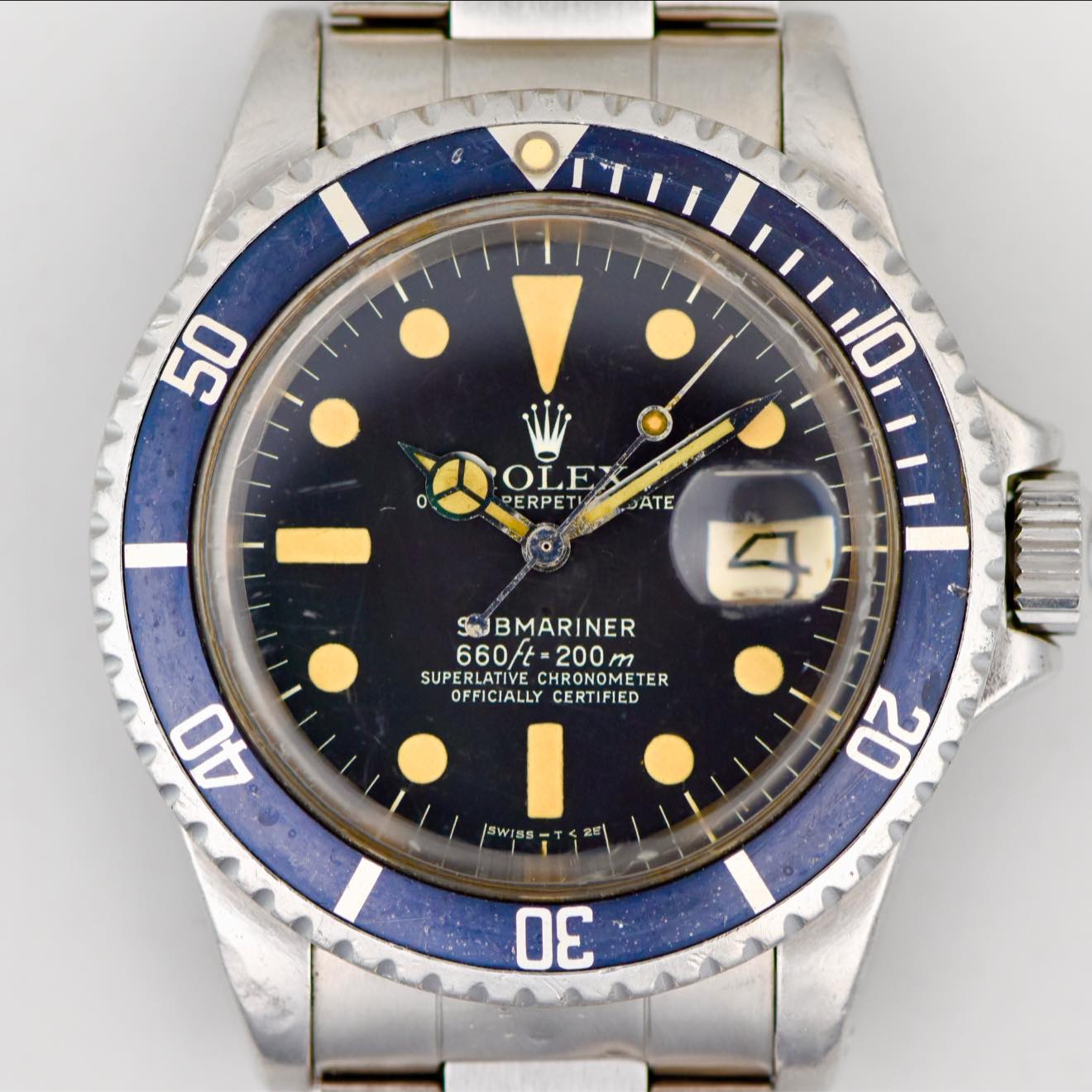 May be an image of wrist watch and text that says '50 0 10 W OLE PERPET PERPETIOATE ATE 4 S BMARINER 660/t 660/-200m 200 SUPERLATIVE SUPE CHRONOMETE ER OFFICIALLY CERTIFIED 40…