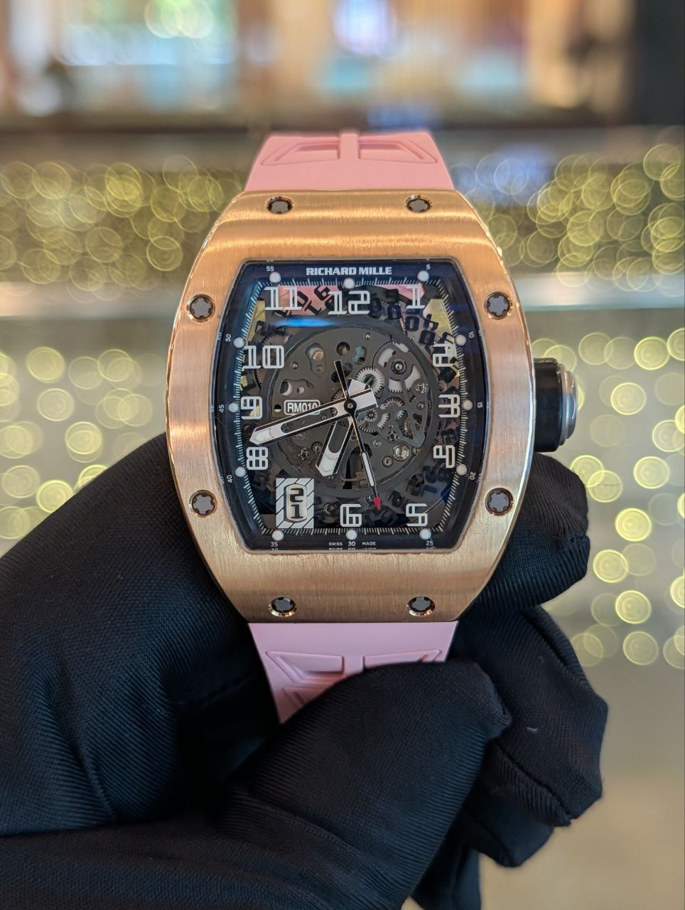 May be an image of wrist watch and text