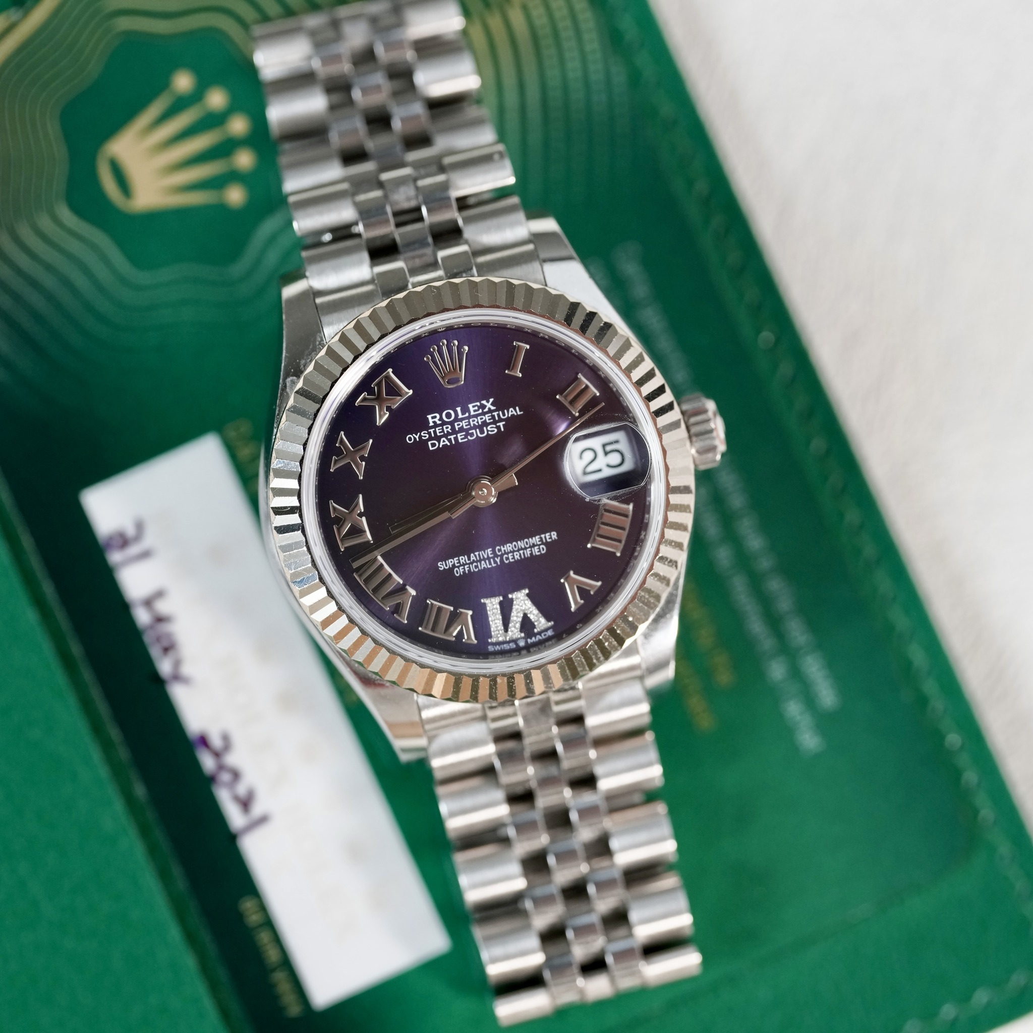 May be an image of wrist watch and text