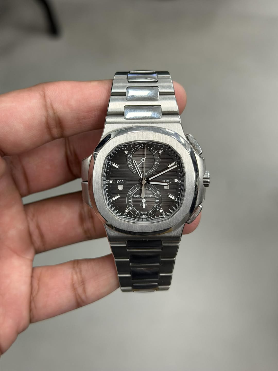 May be an image of wrist watch and text