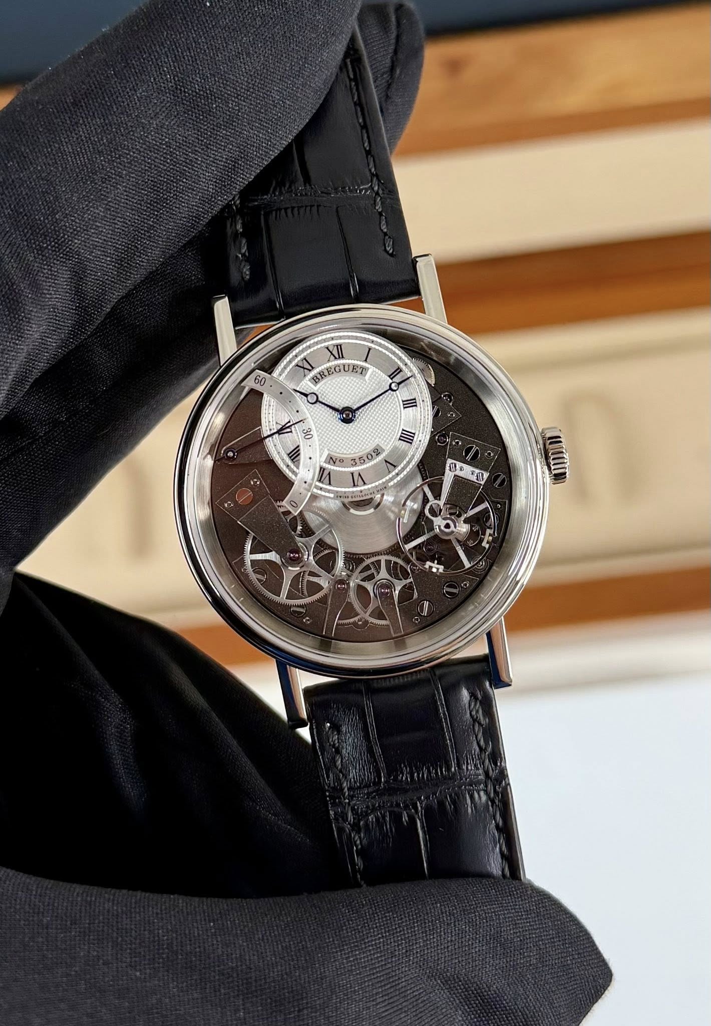 May be an image of wrist watch and text that says '60 XII XI BREGUET SREGU O 30 I No -'