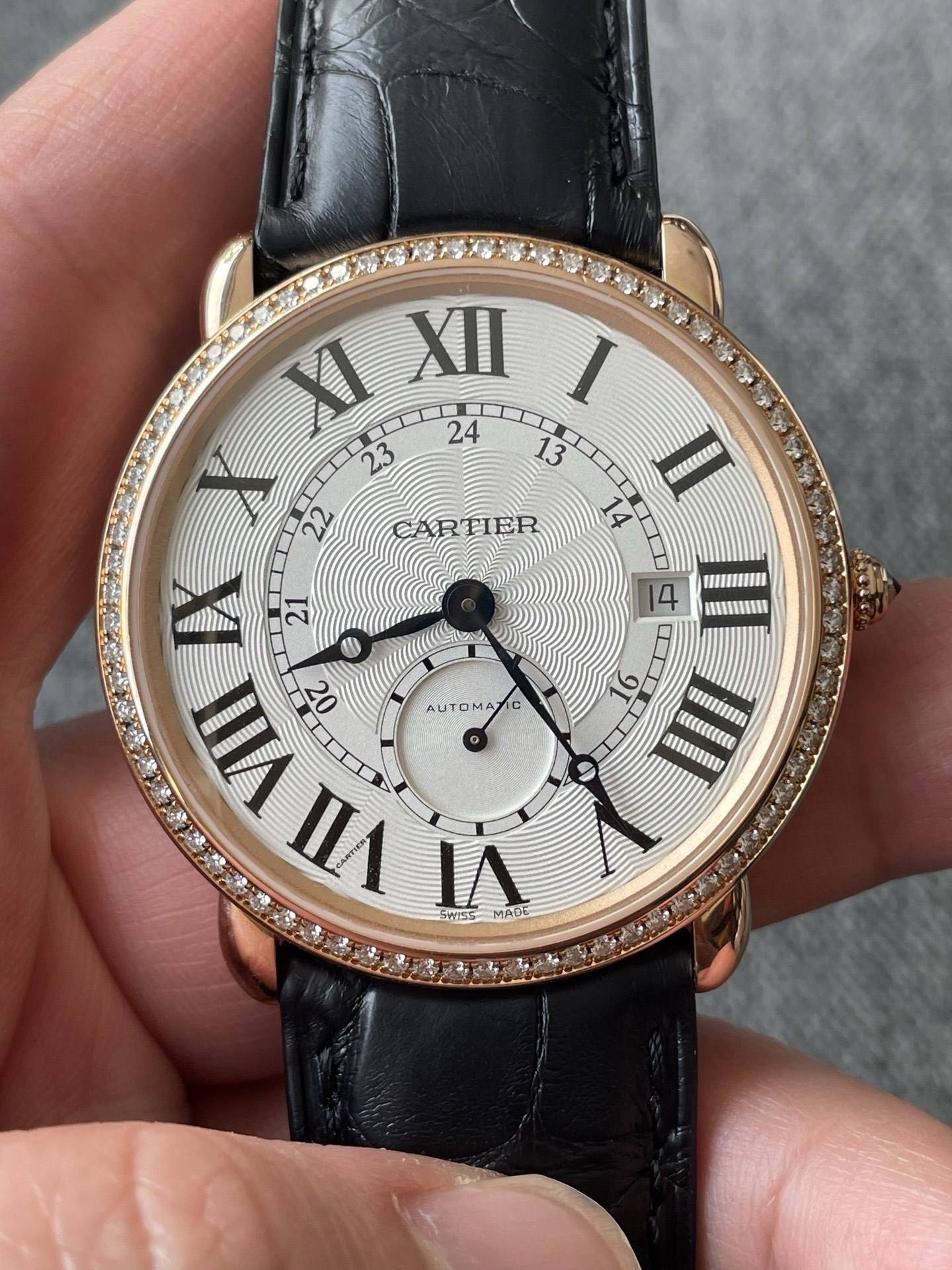 May be an image of wrist watch and text