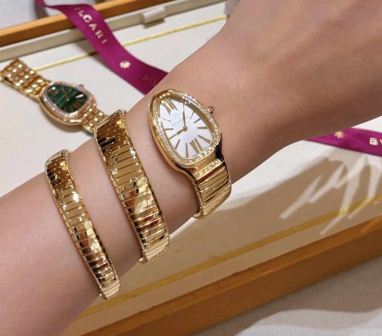 May be an image of jewelry, wrist watch and text