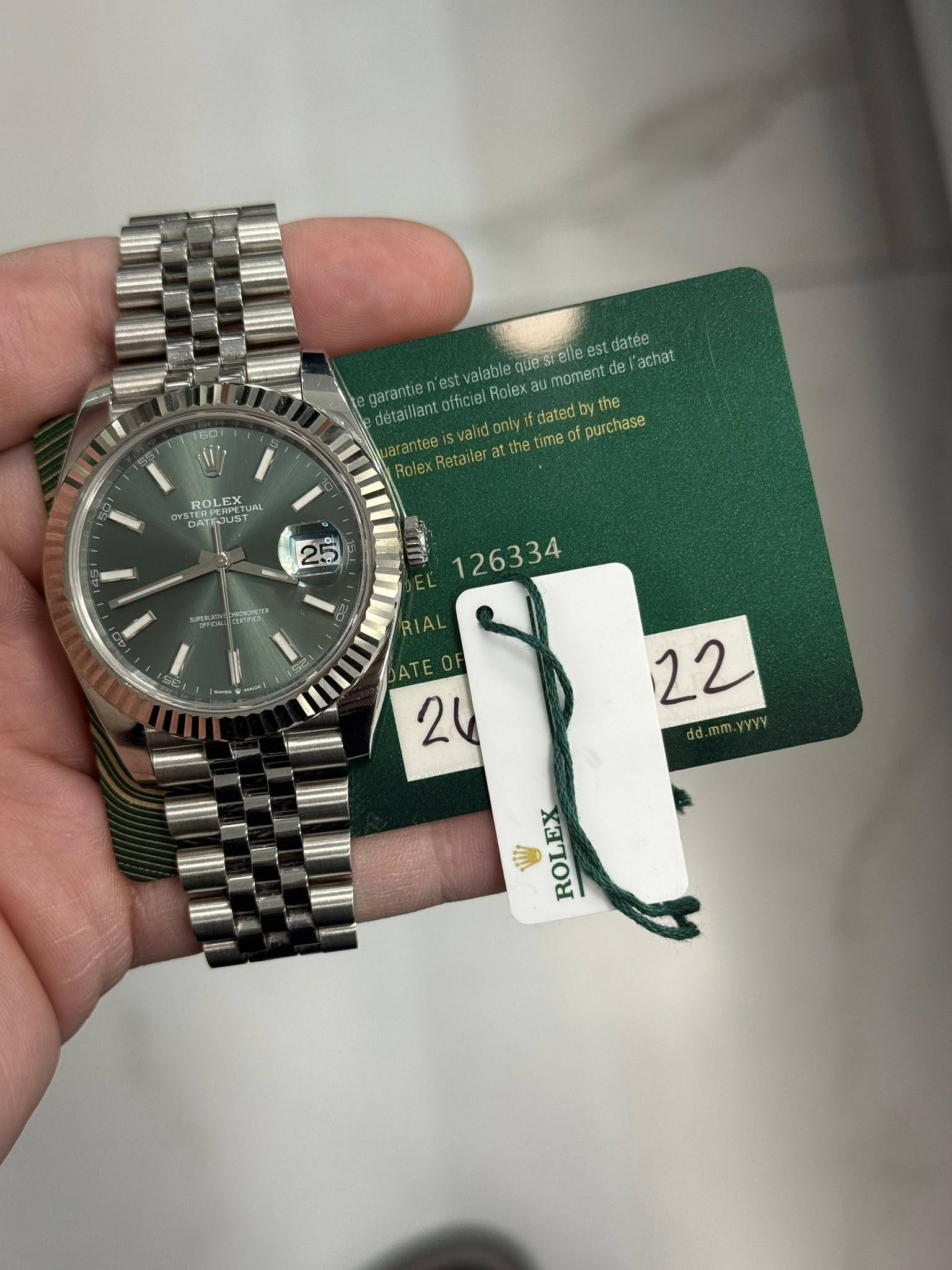 May be an image of wrist watch and text