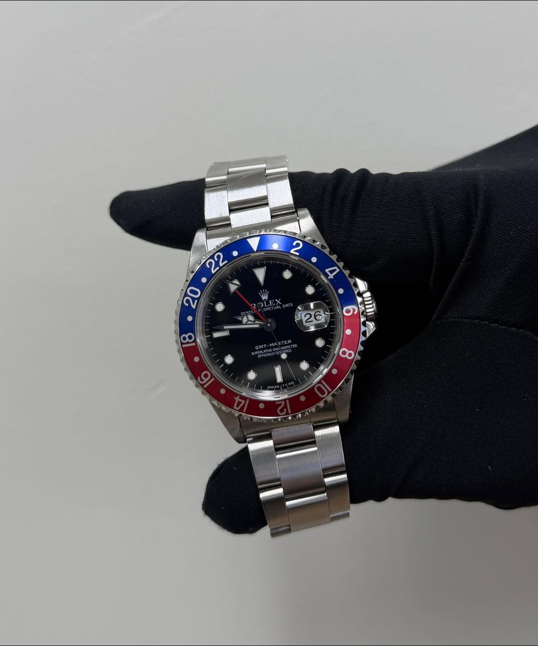 May be an image of wrist watch and text