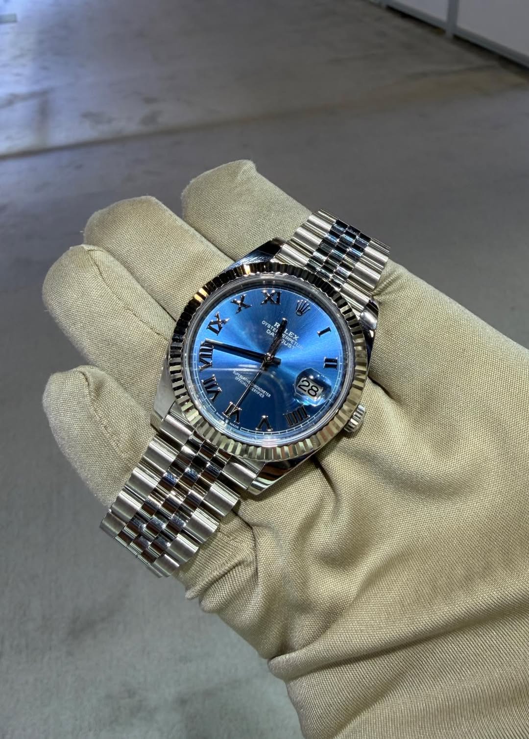 May be an image of wrist watch and text