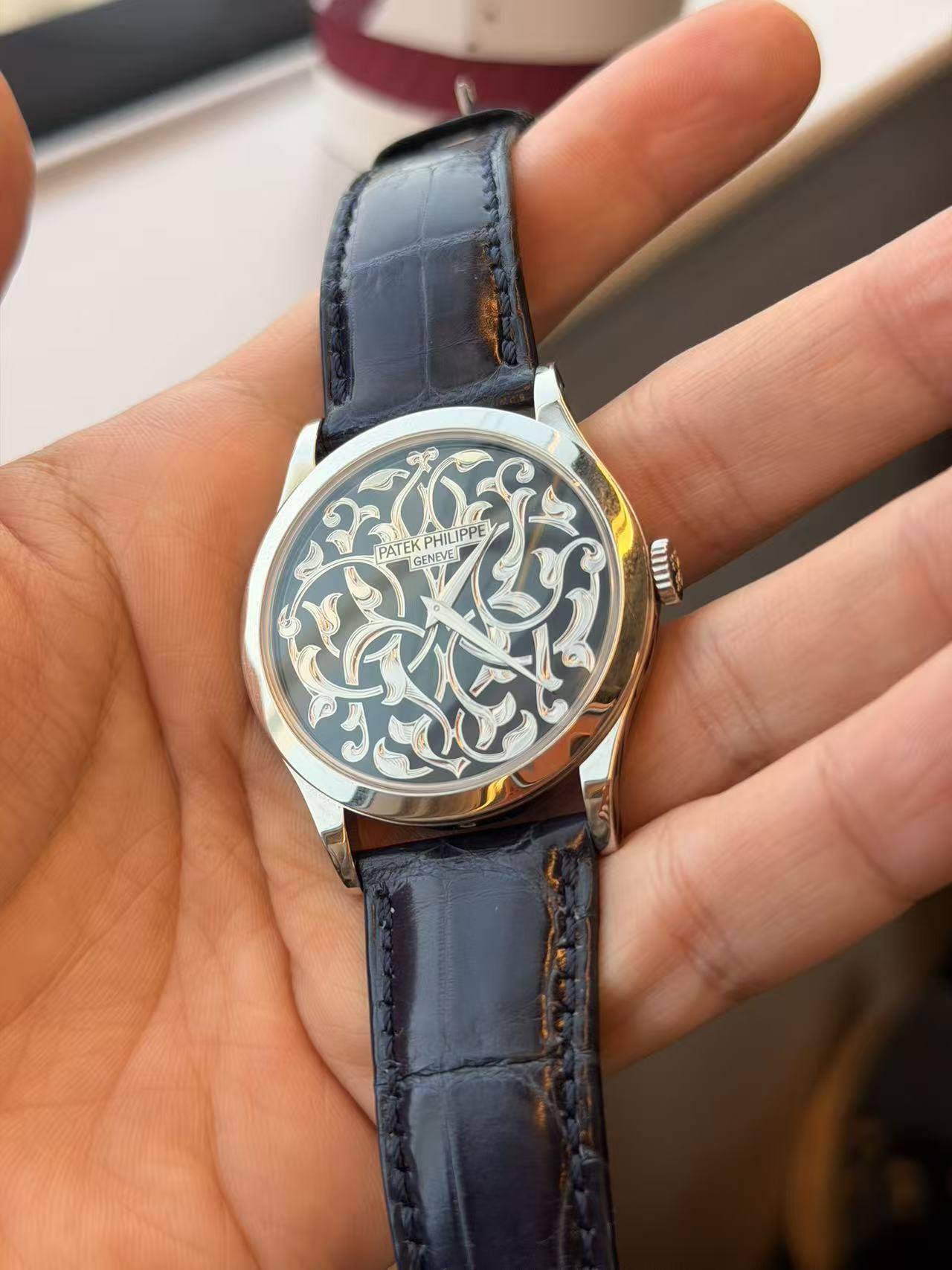 May be an image of wrist watch and text
