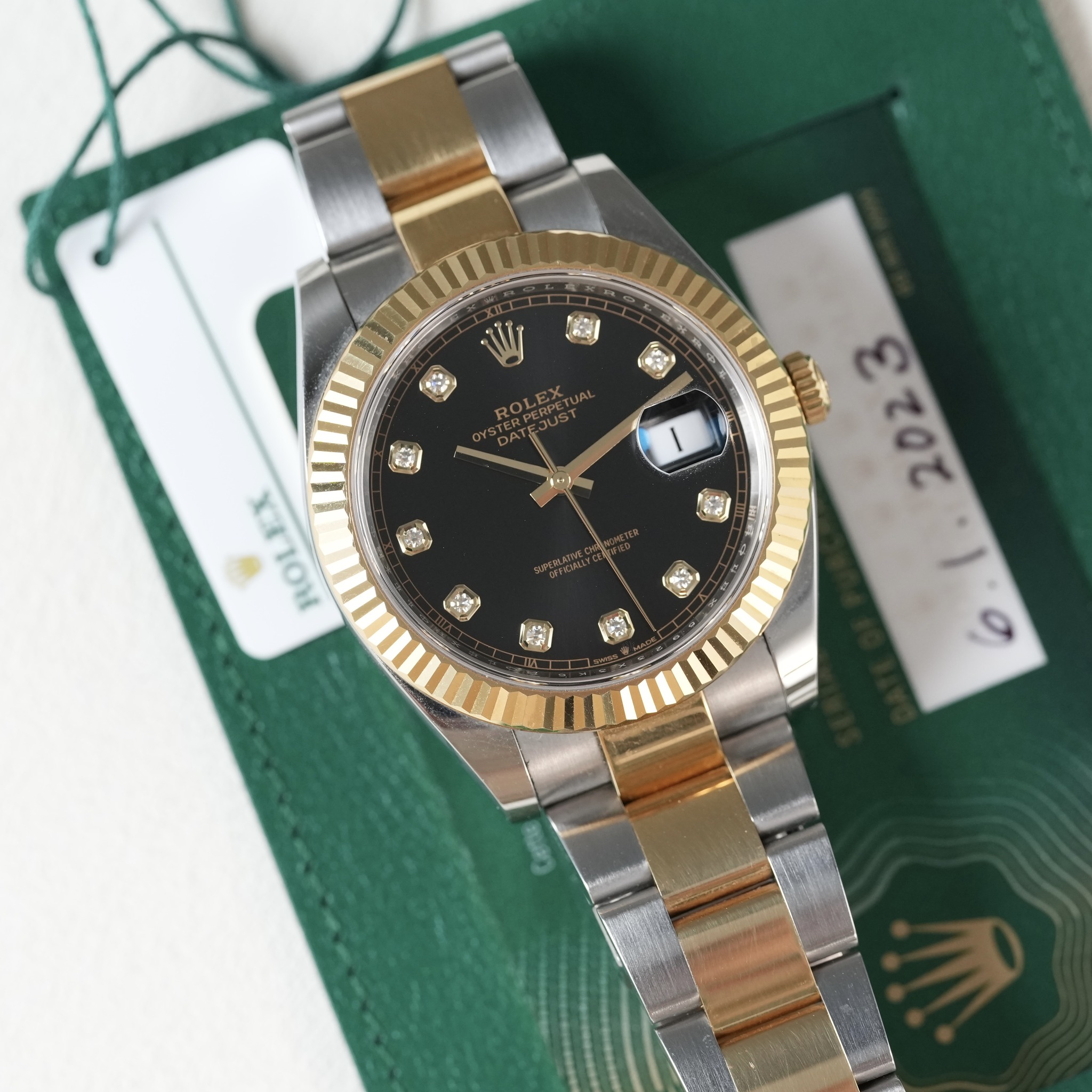 May be an image of wrist watch and text