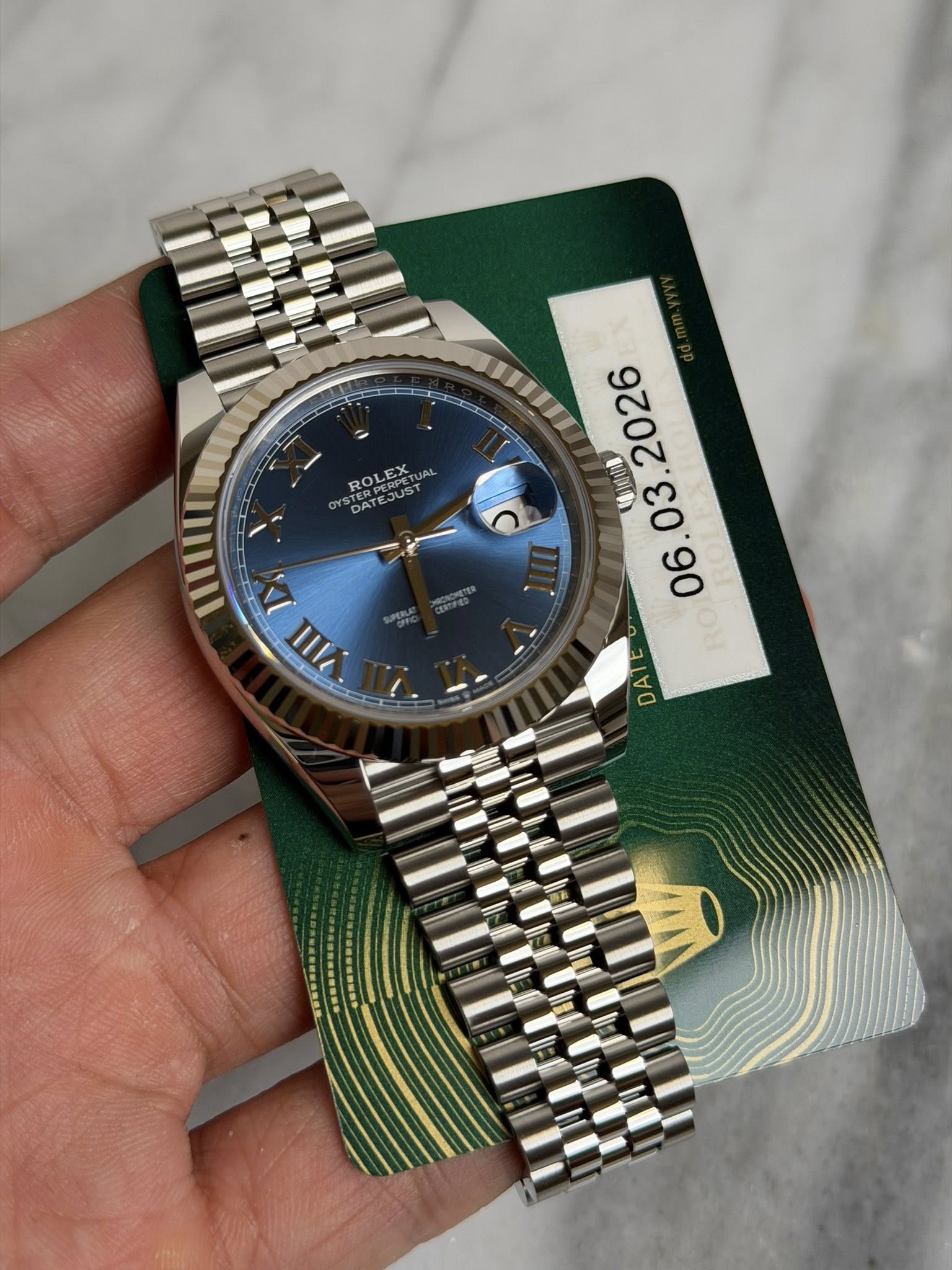 May be an image of wrist watch and text that says 'ROOPE ROLEX ERPER PERPETU EX ST DATE mIIII D 1 VIlI 11k 博/度山車 06. DA'