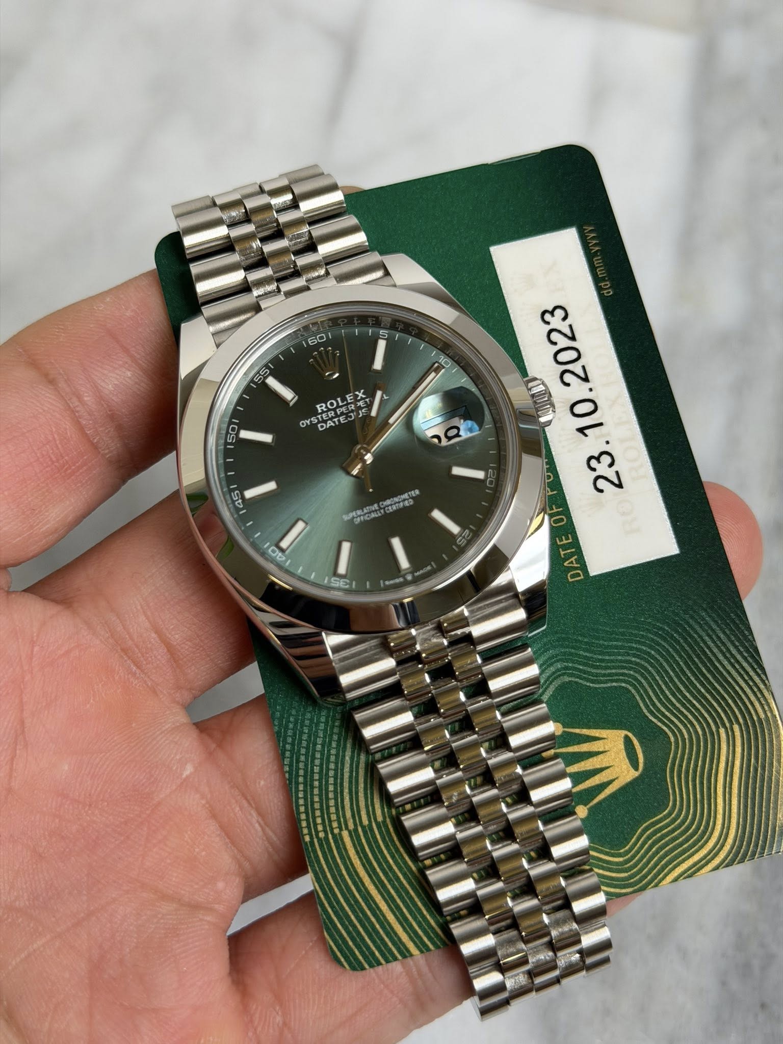 May be an image of wrist watch and text that says '60 10 ROL ROLE OYS TERIL DAT DAT 45 PERLATNE CeTe 0 AO O UUBI . DATE DA SE o'