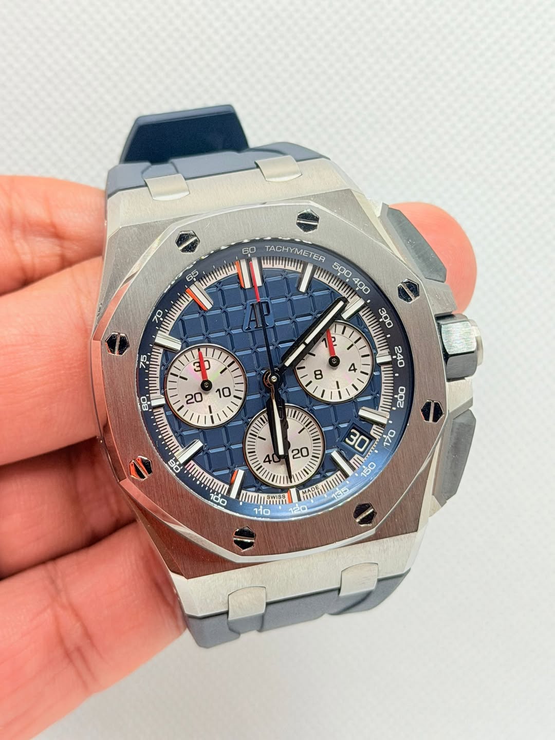 May be an image of wrist watch and text