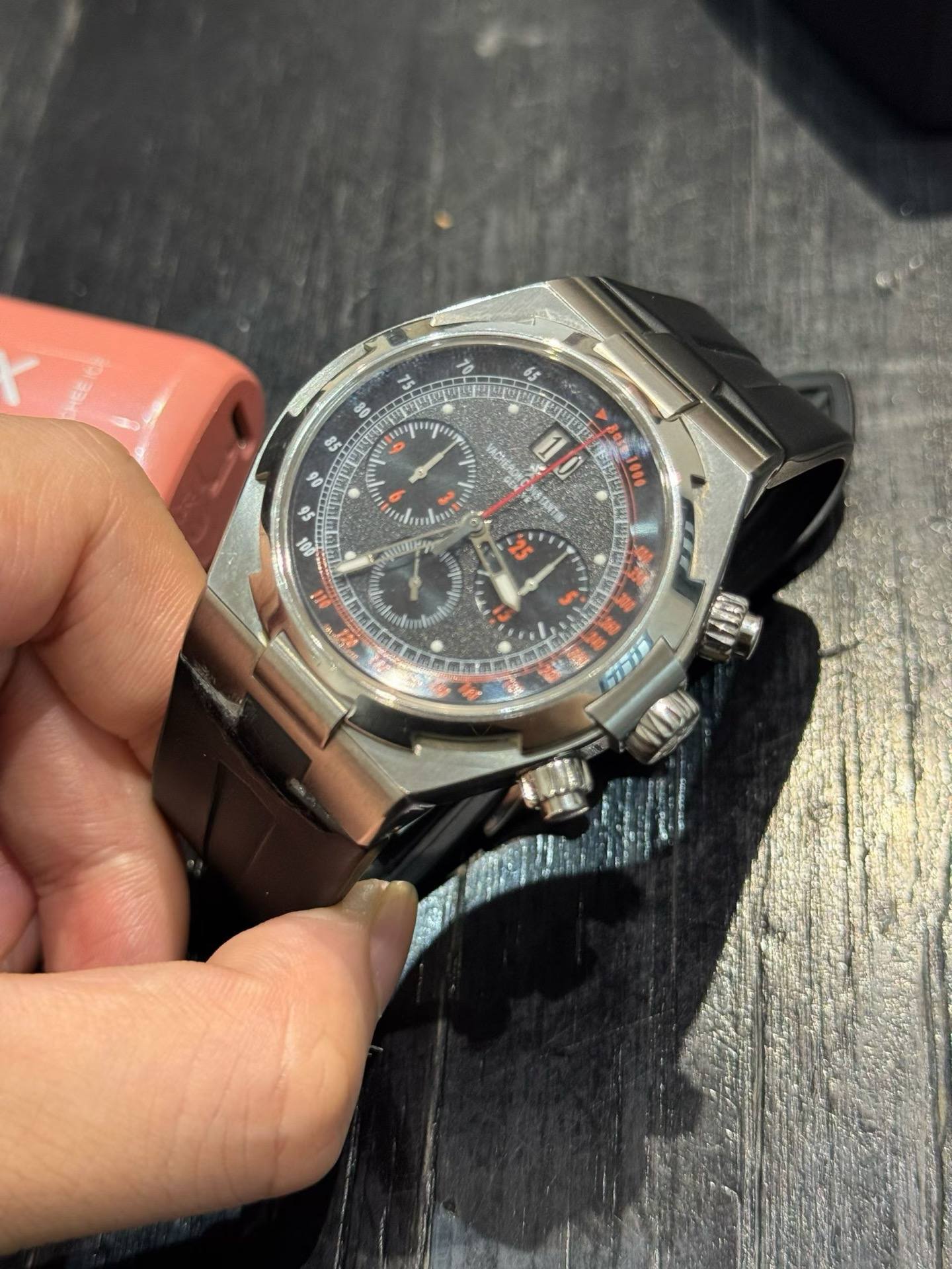 May be an image of wrist watch and text