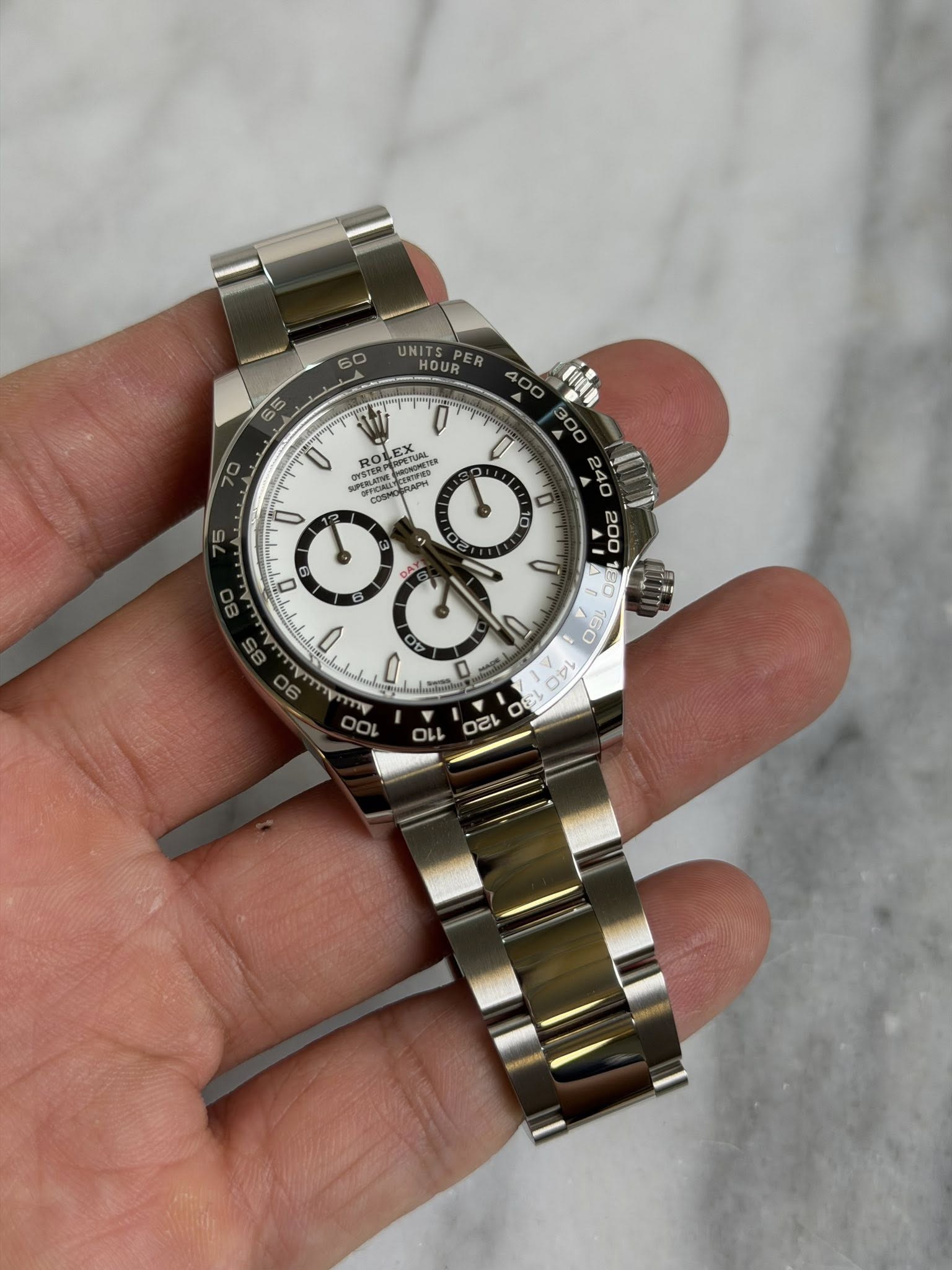 May be an image of wrist watch and text