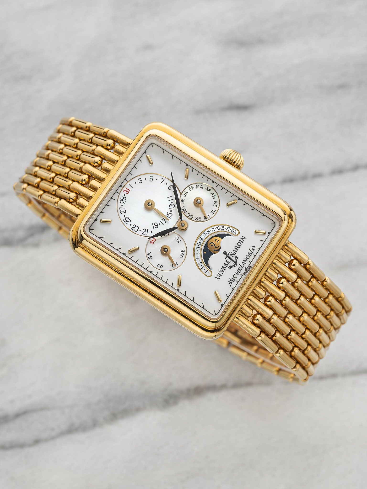 May be an image of jewelry, wrist watch and text