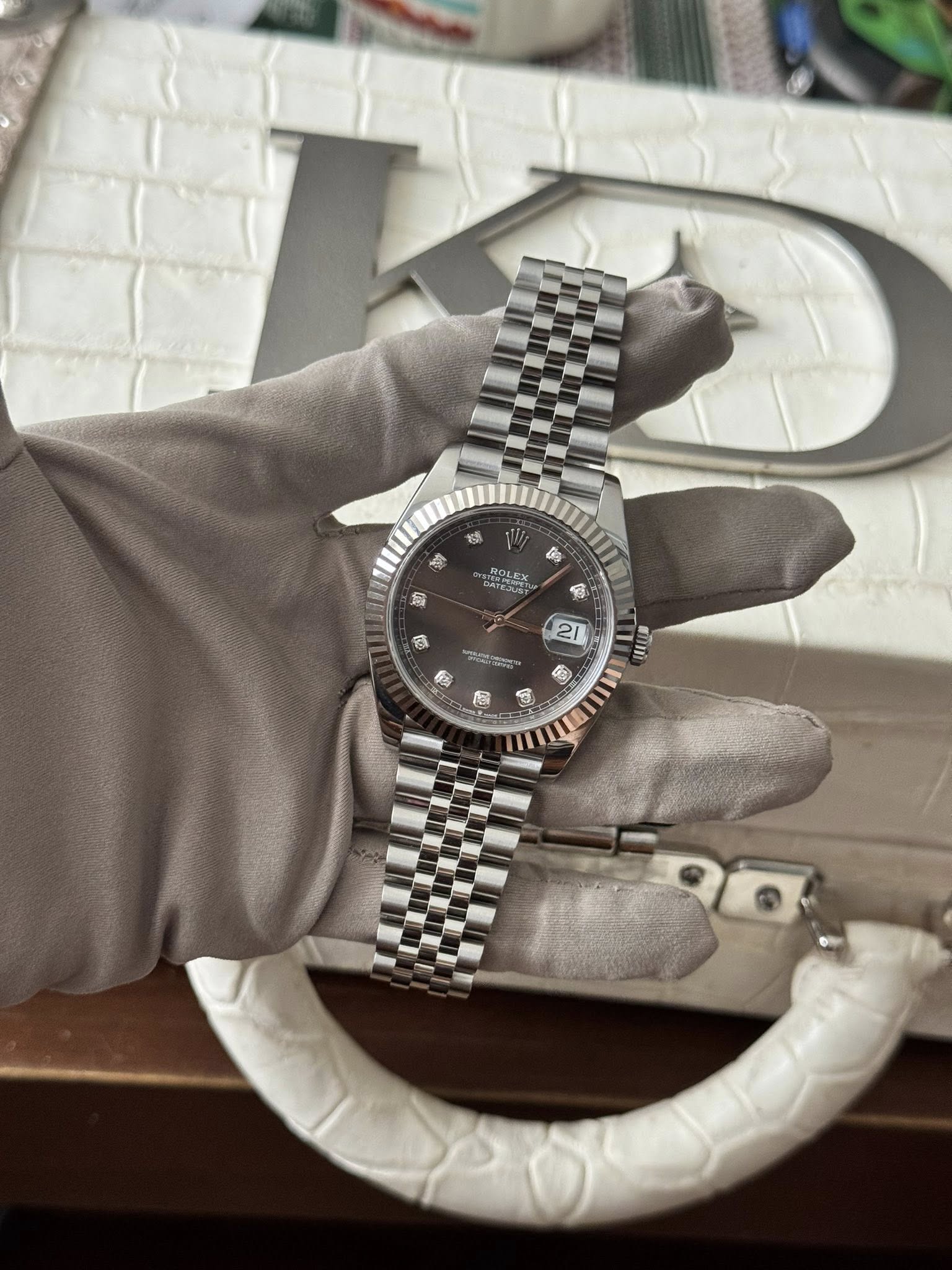 May be an image of wrist watch and text