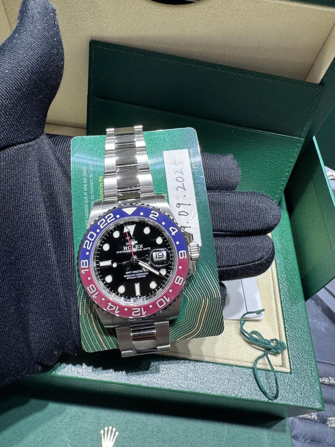 May be an image of wrist watch and text