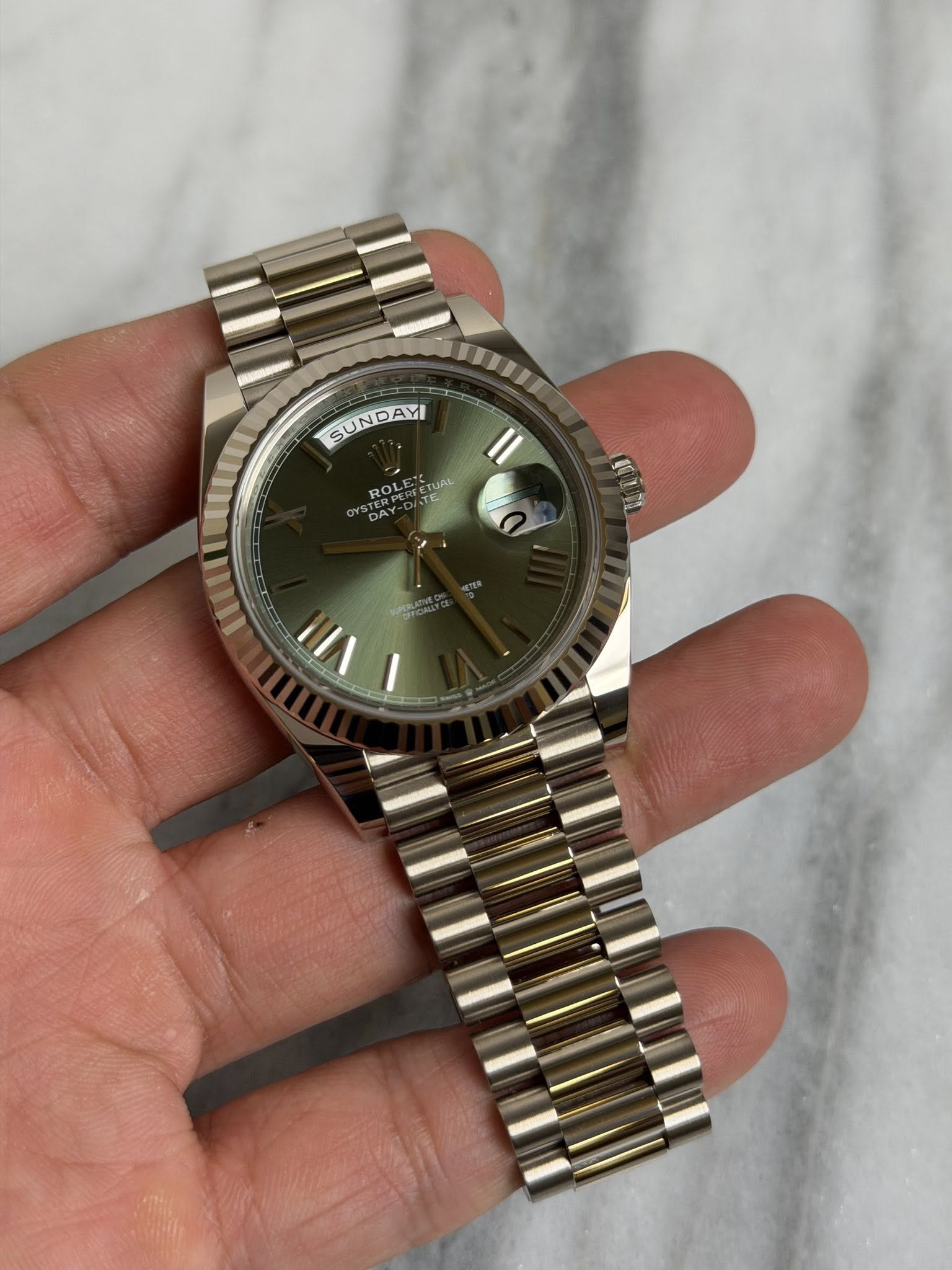 May be an image of wrist watch and text