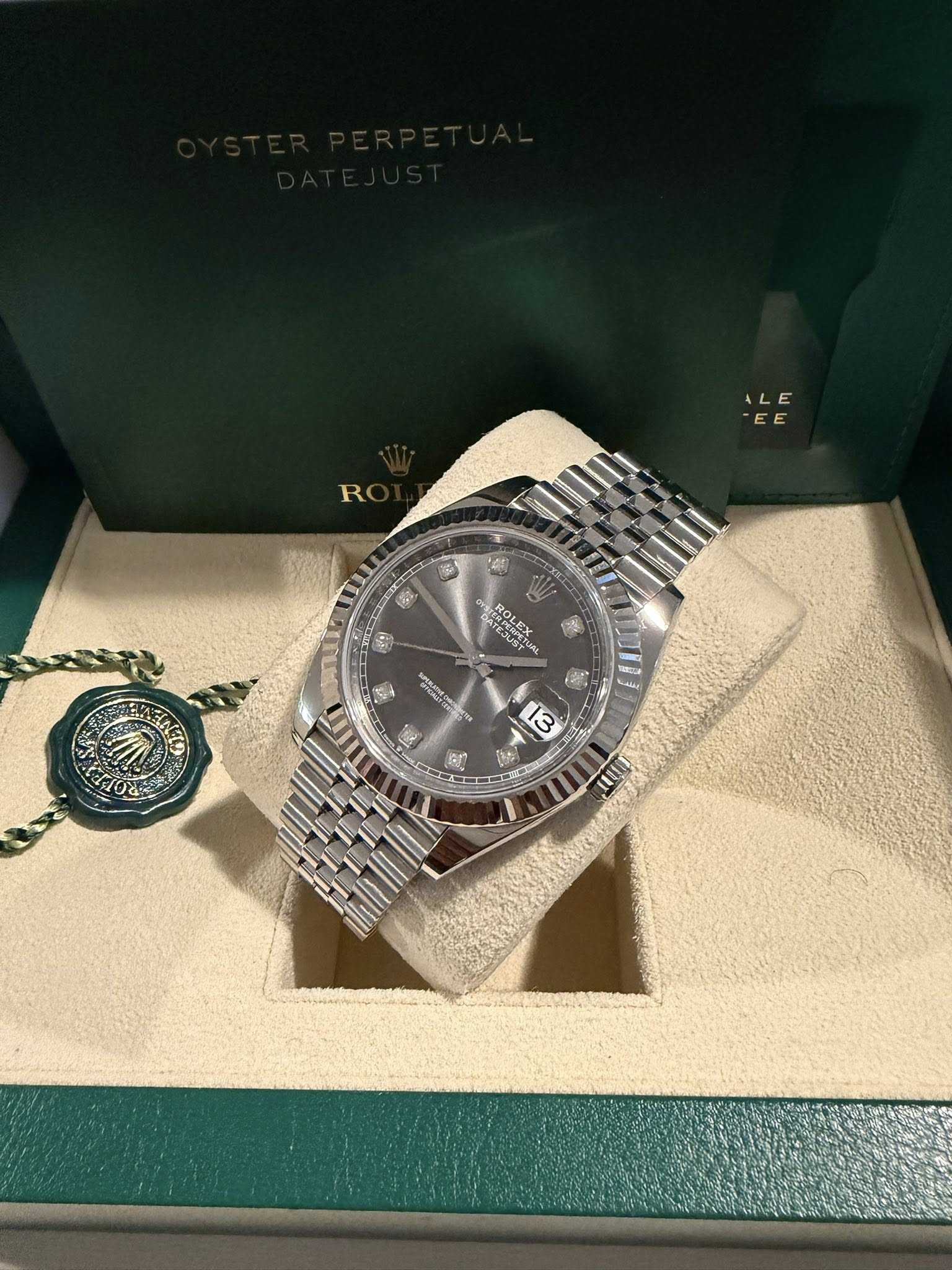 May be an image of wrist watch and text