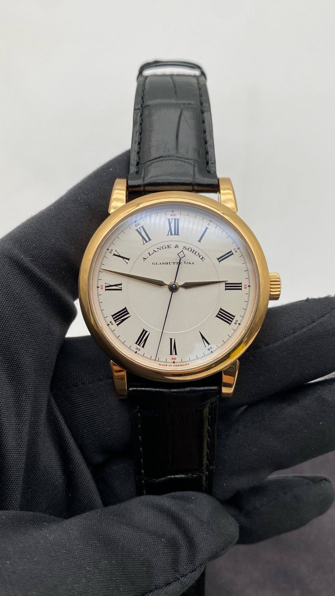May be an image of wrist watch and text