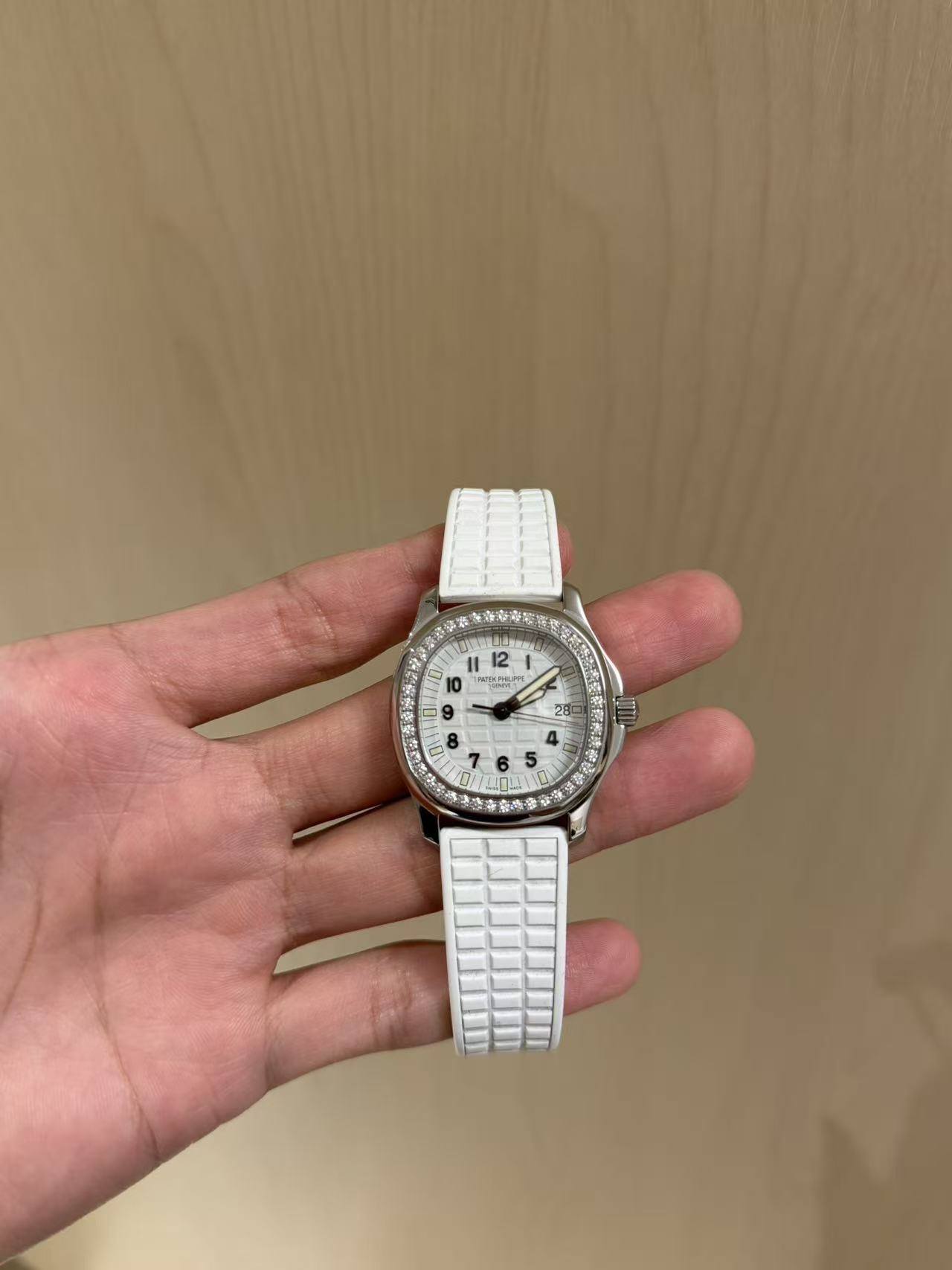 May be an image of wrist watch and text