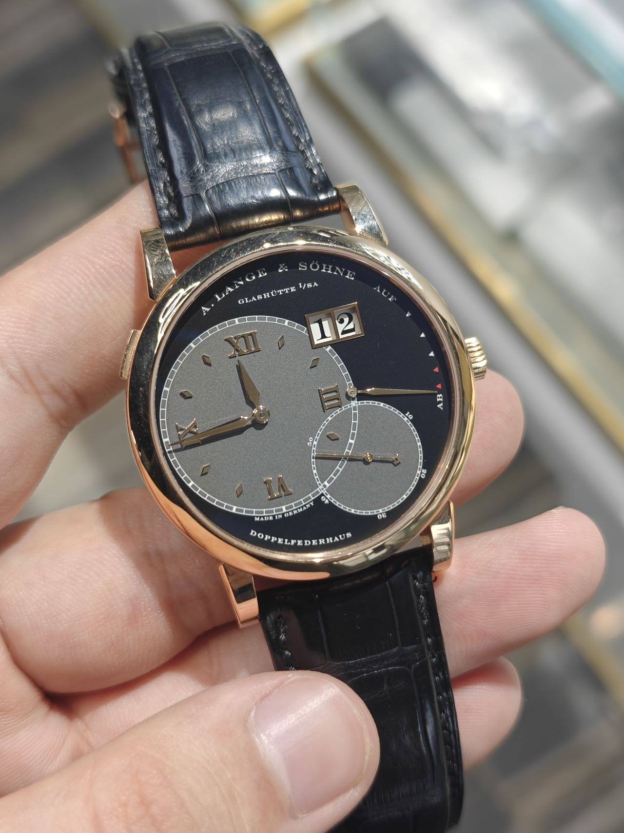 May be an image of wrist watch and text