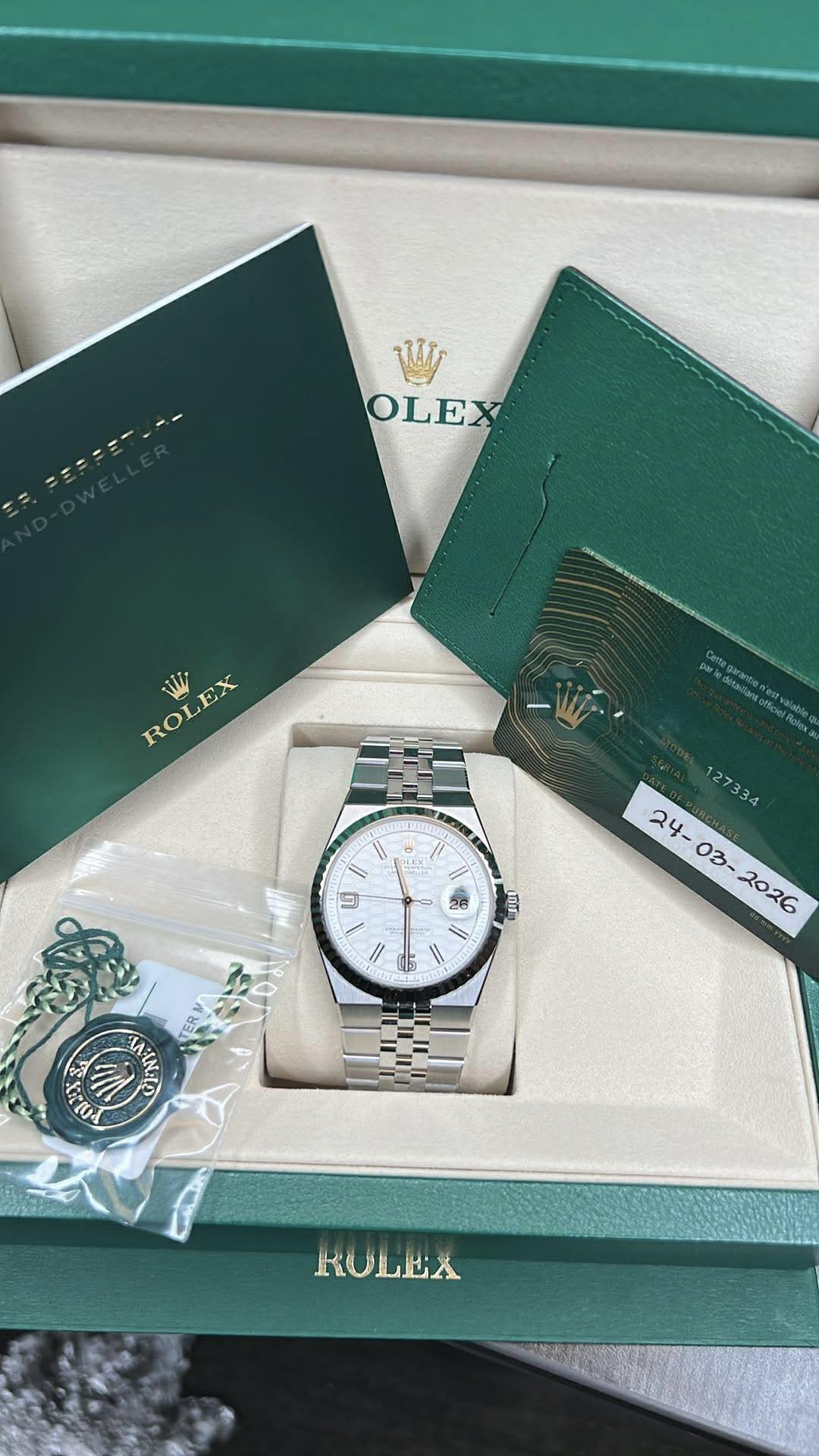 May be an image of wrist watch and text