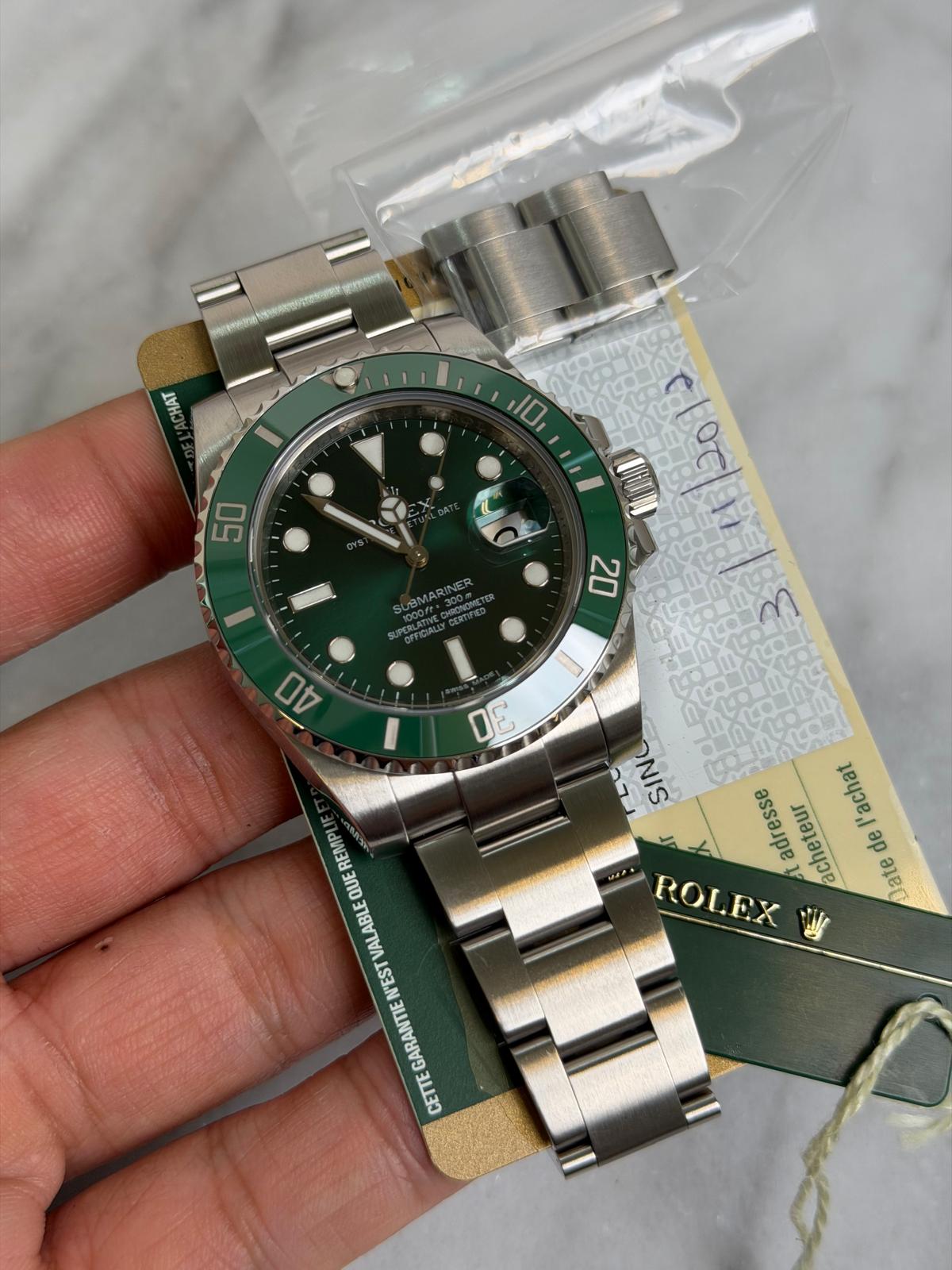 May be an image of wrist watch and text that says '1ΑΥ CHAT 10 50 OZ 40 DE N SIN adresse acheteur l'achat de رون ROLEX ate REMPL QUE ALABLE VAL 'EST GARANTIE CEEE'