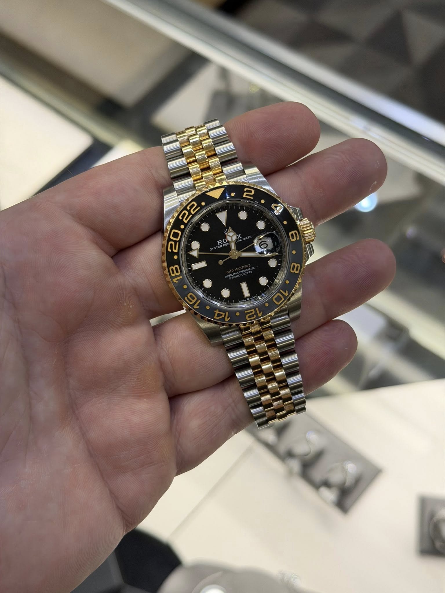 May be an image of wrist watch and text