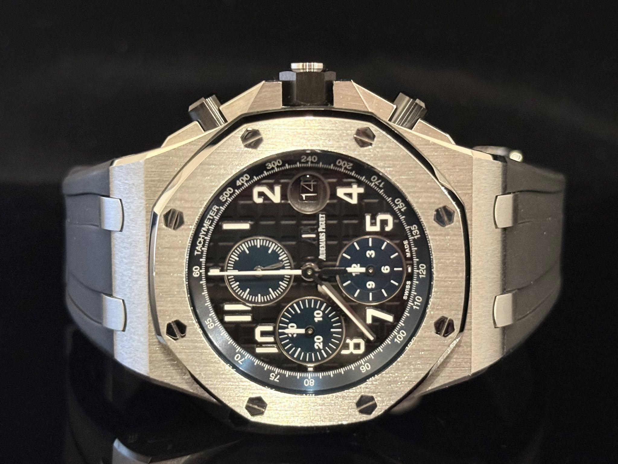 May be an image of wrist watch and text