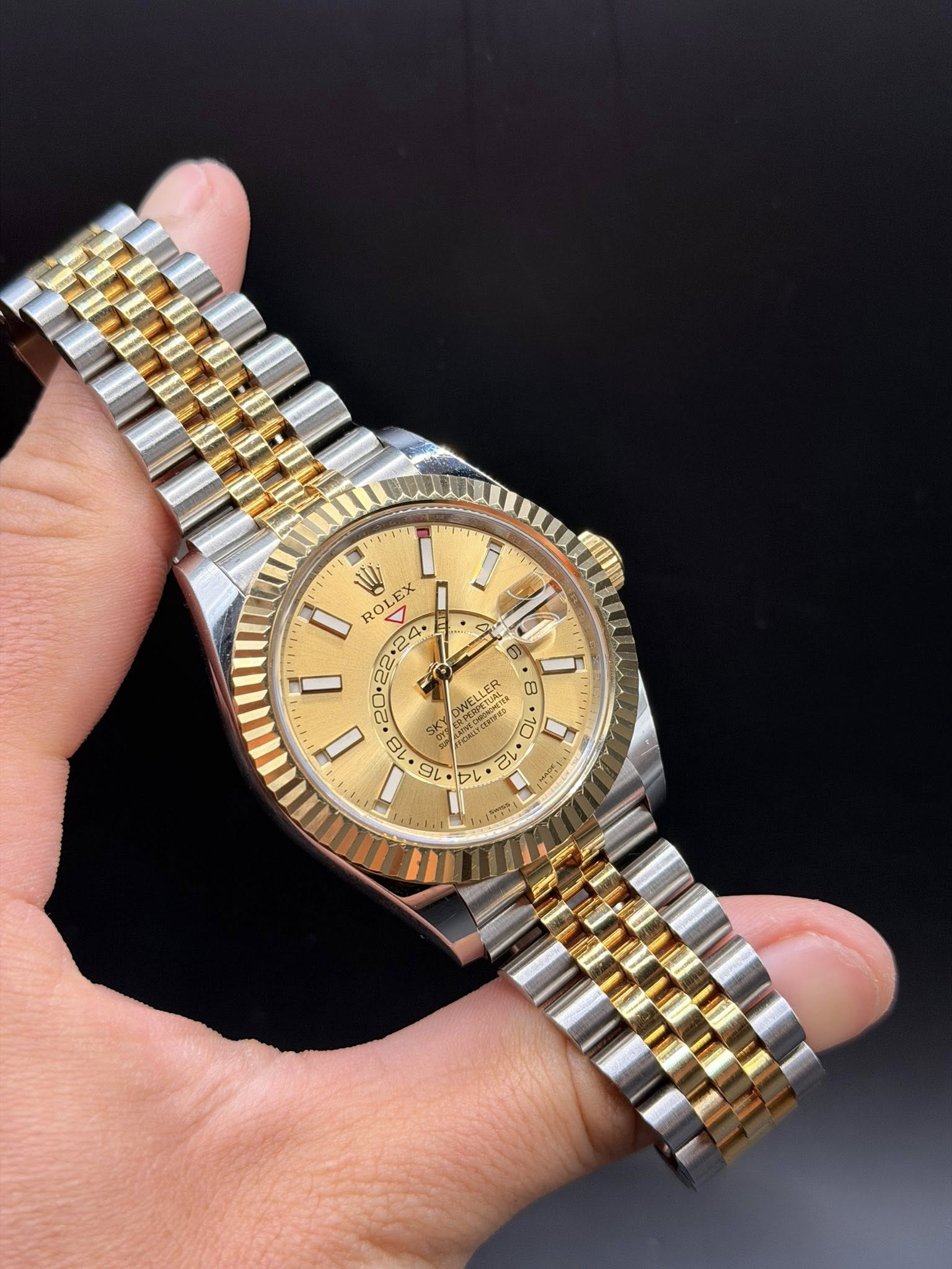 May be an image of wrist watch and text