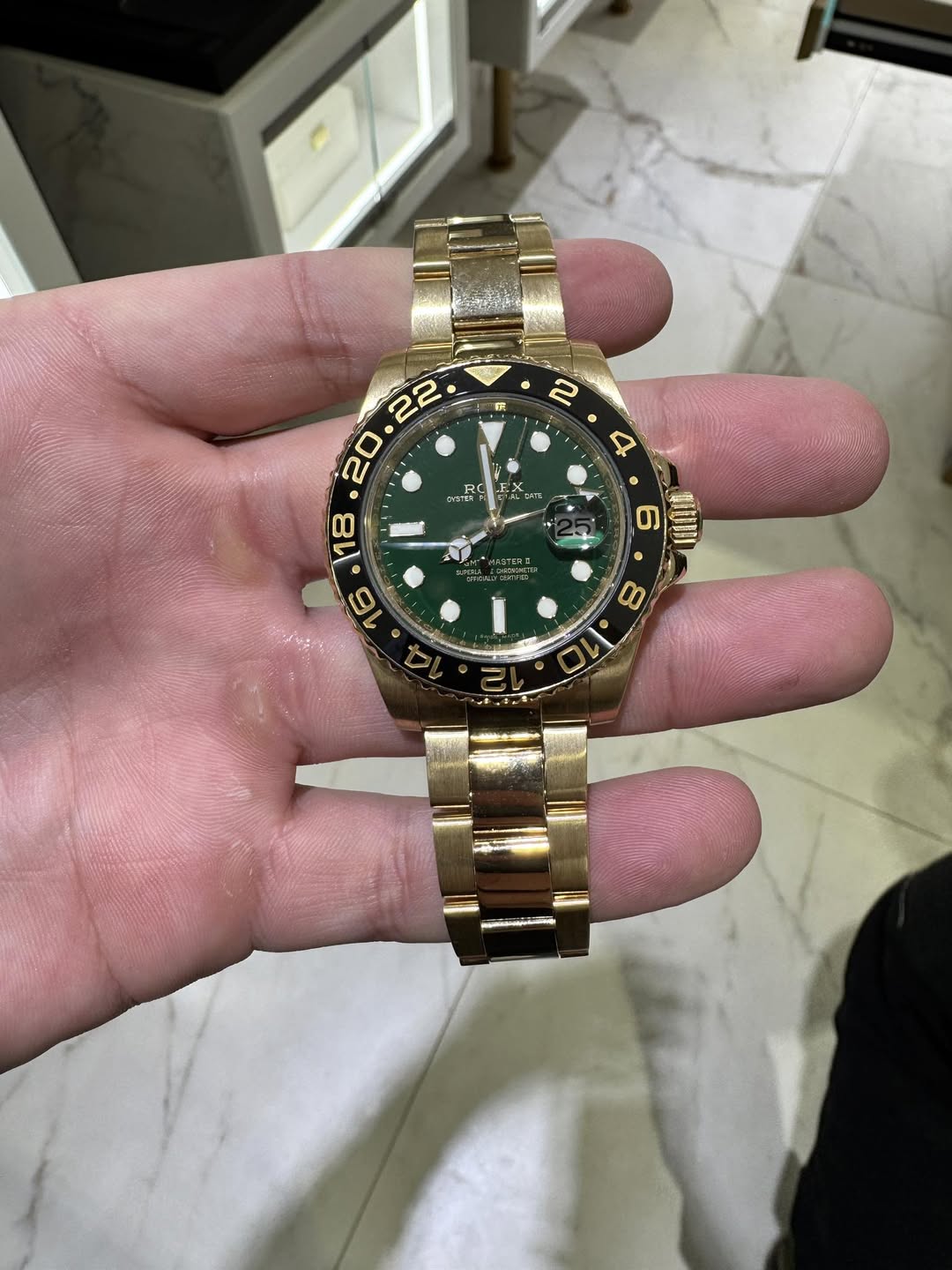 May be an image of wrist watch and text