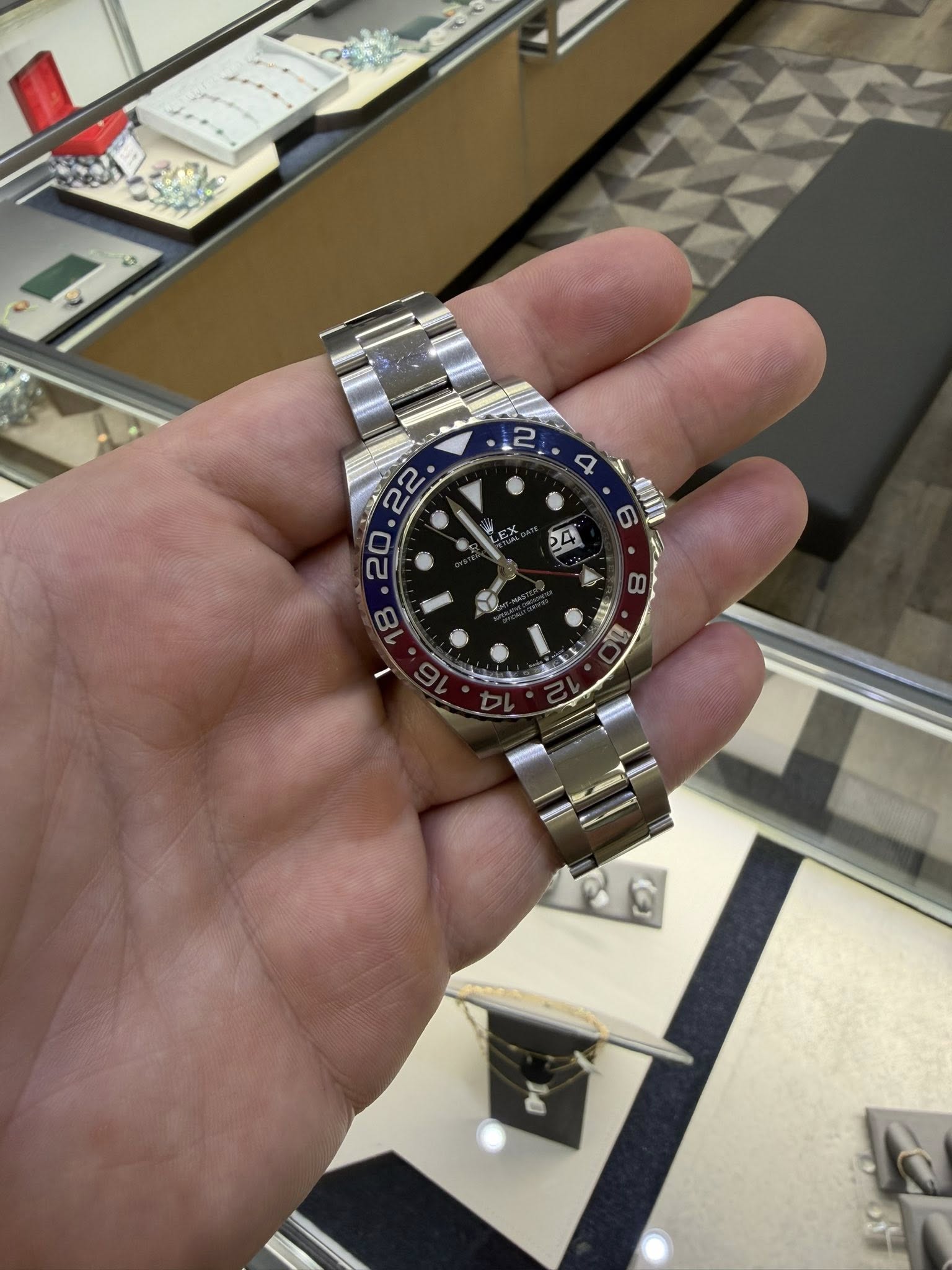May be an image of wrist watch and text