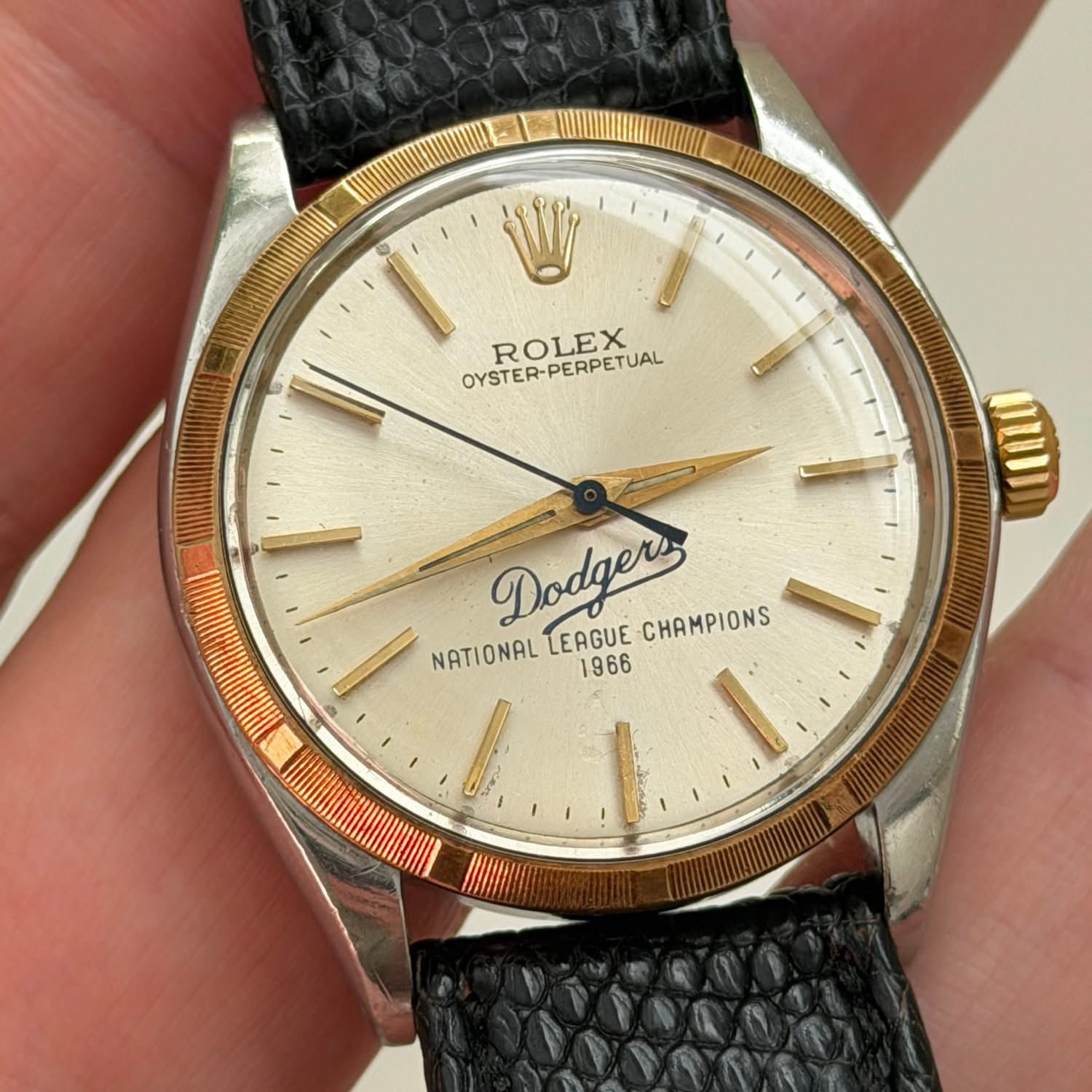 May be an image of wrist watch and text that says 'OYSTER-PERPETUAL ROLEX OUD NATIONAL Dodgers LEAGUE CHAMPIONS 1966 L JAN'