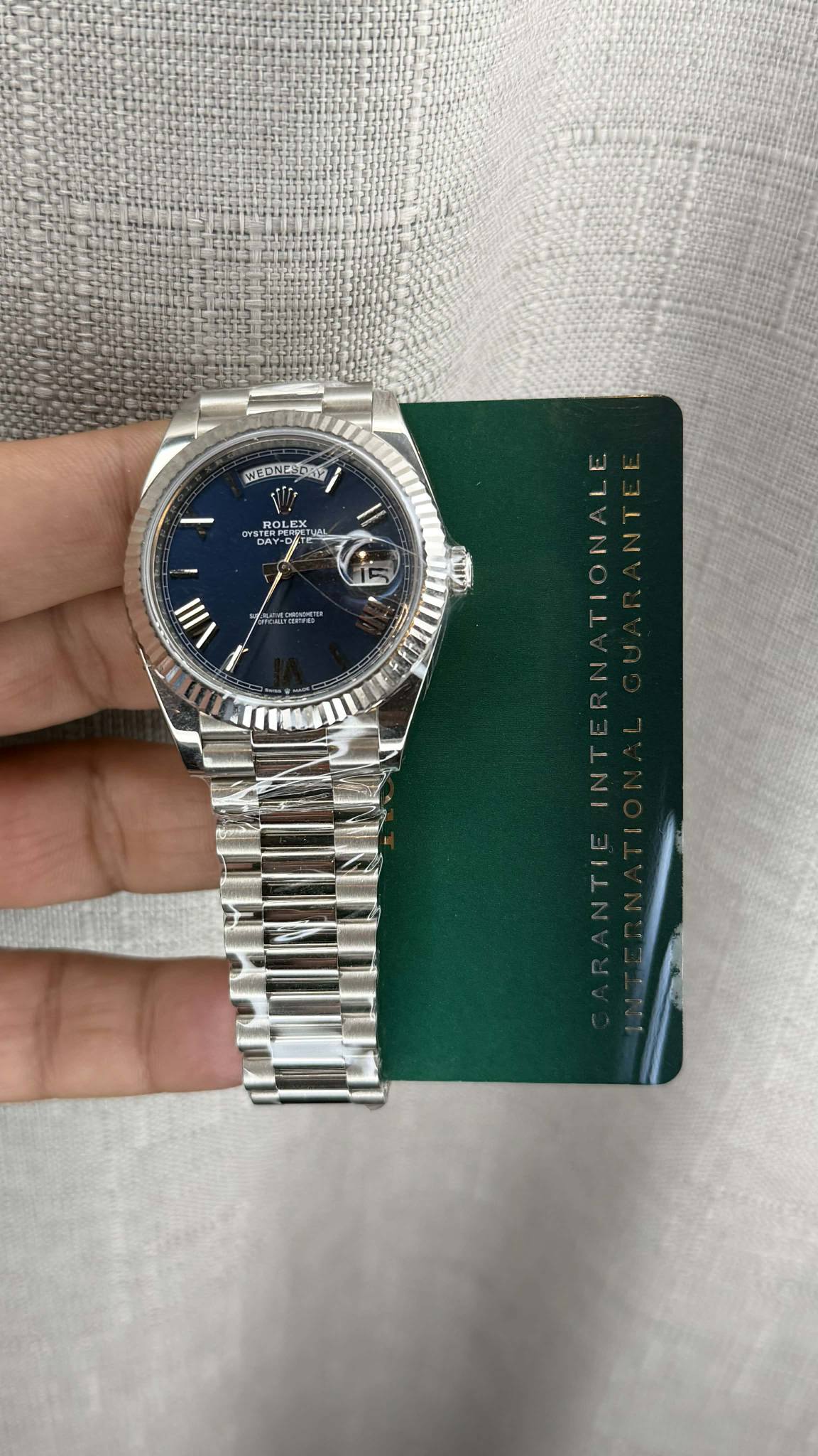 May be an image of wrist watch and text