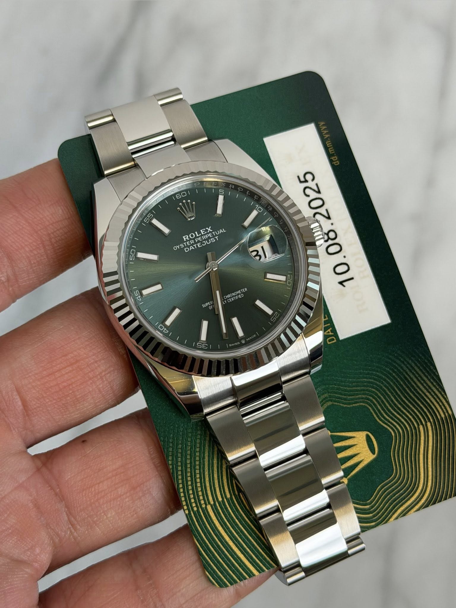 May be an image of wrist watch and text that says '60 50 10 ROLEX TUAL JAL JUST OY3 DAT കപട DA 50 50 MIM O H 00'