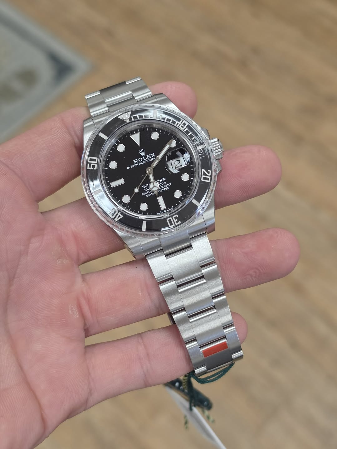 May be an image of wrist watch and text