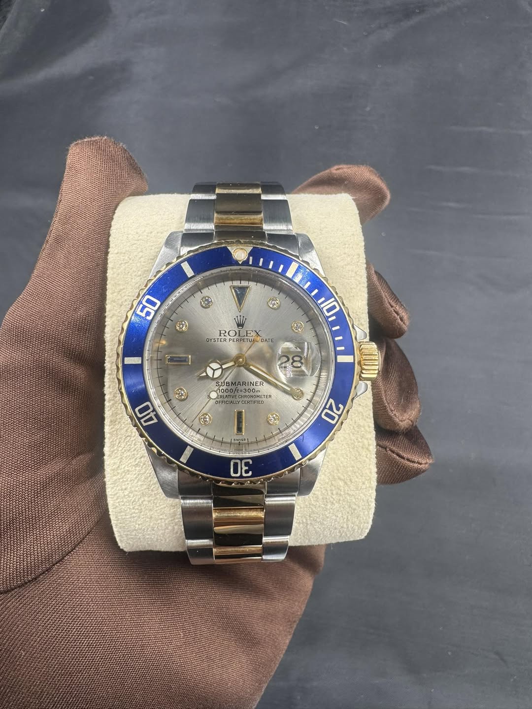 May be an image of wrist watch and text