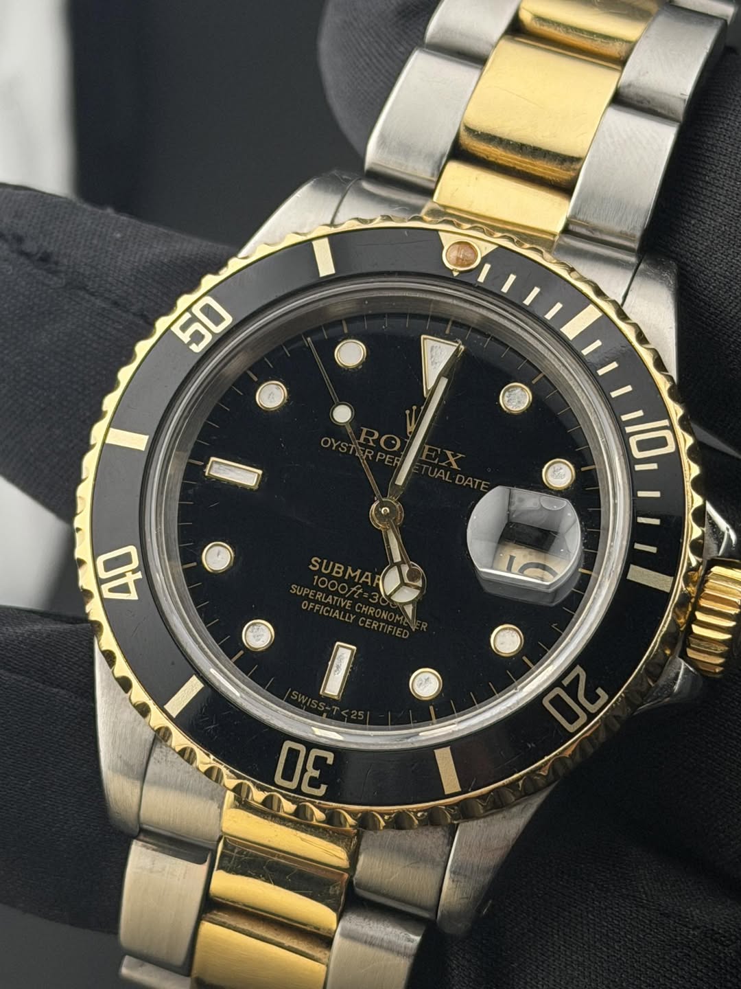 May be an image of wrist watch and text