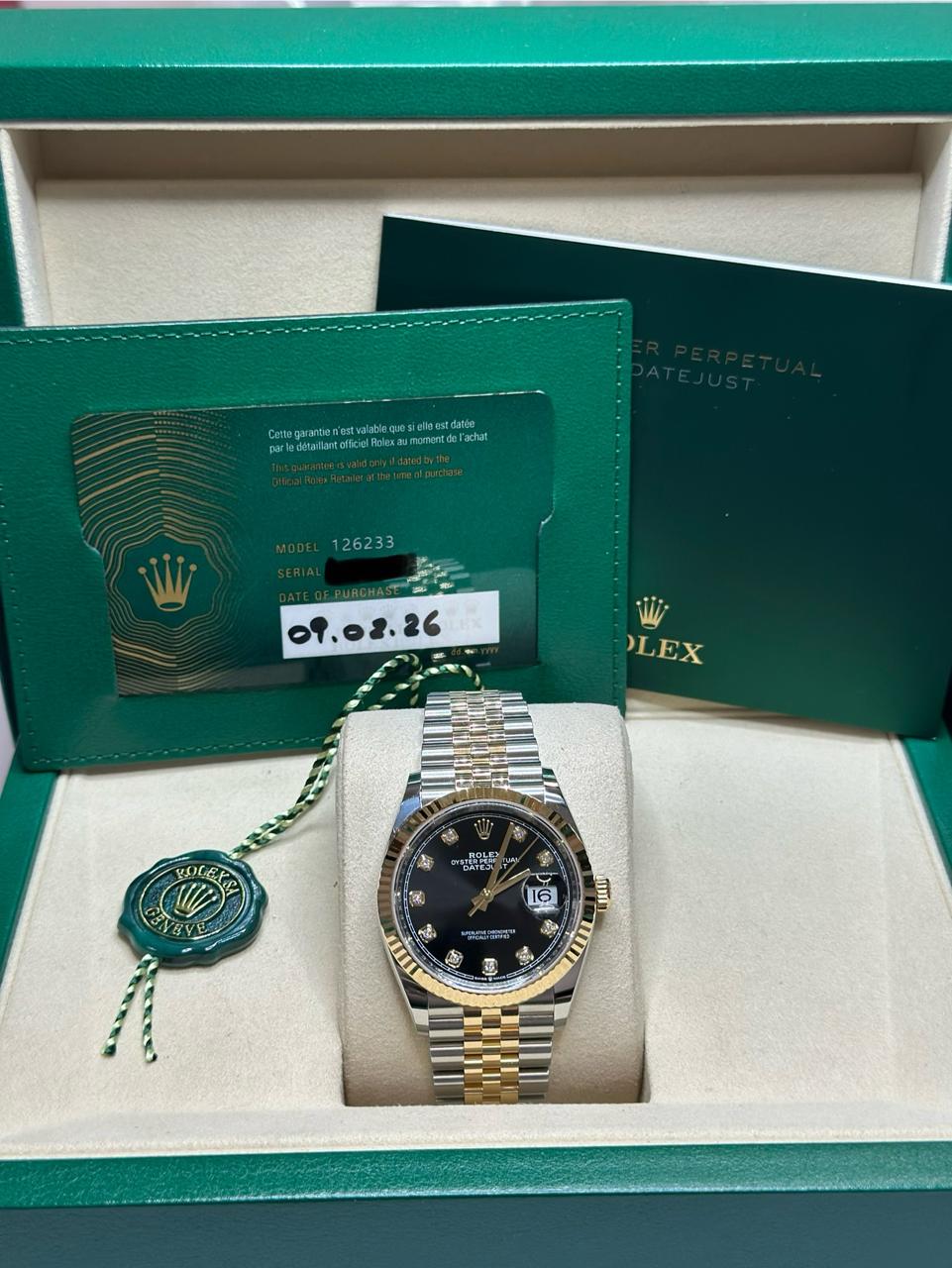May be an image of wrist watch and text
