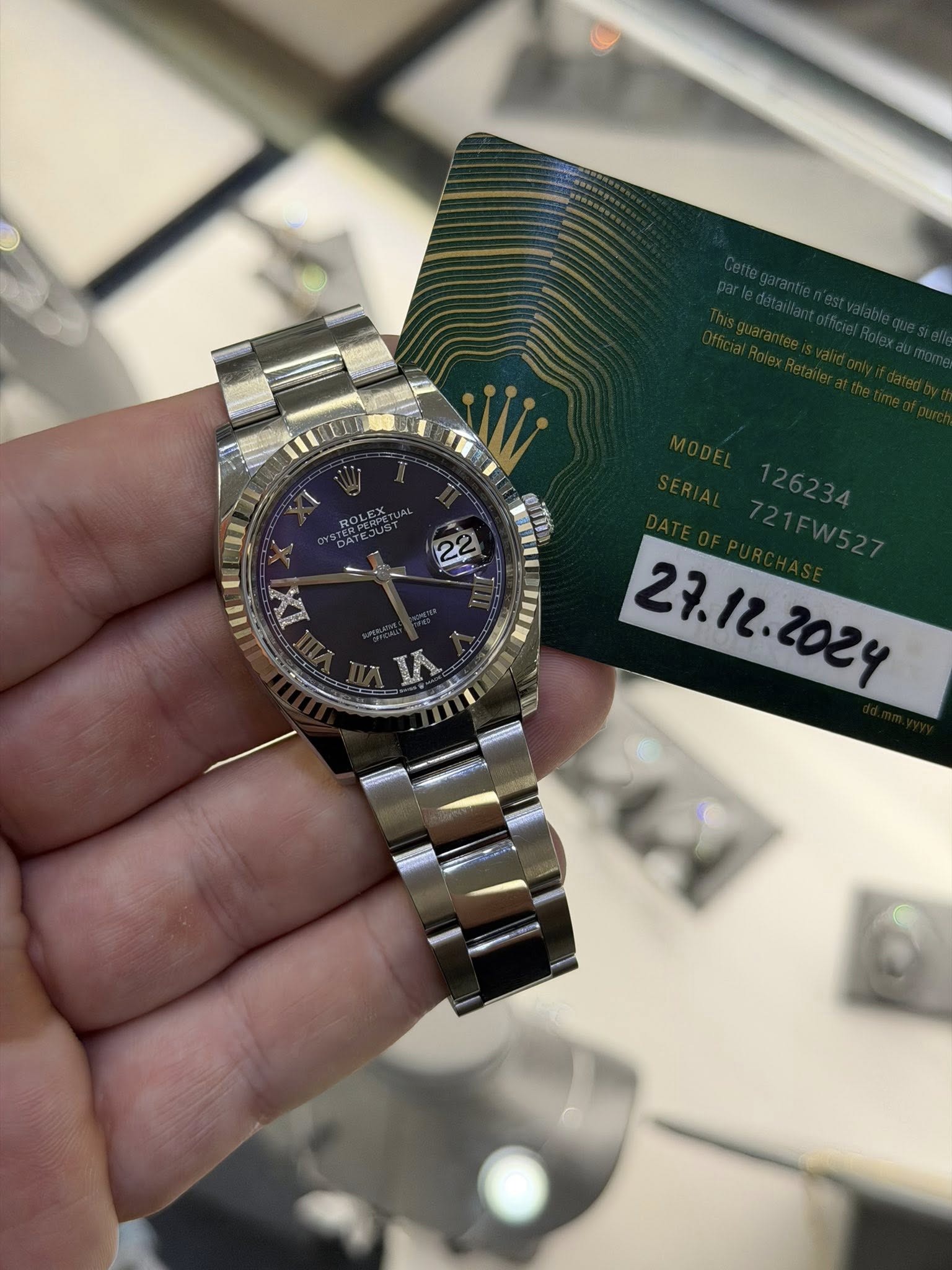 May be an image of wrist watch and text