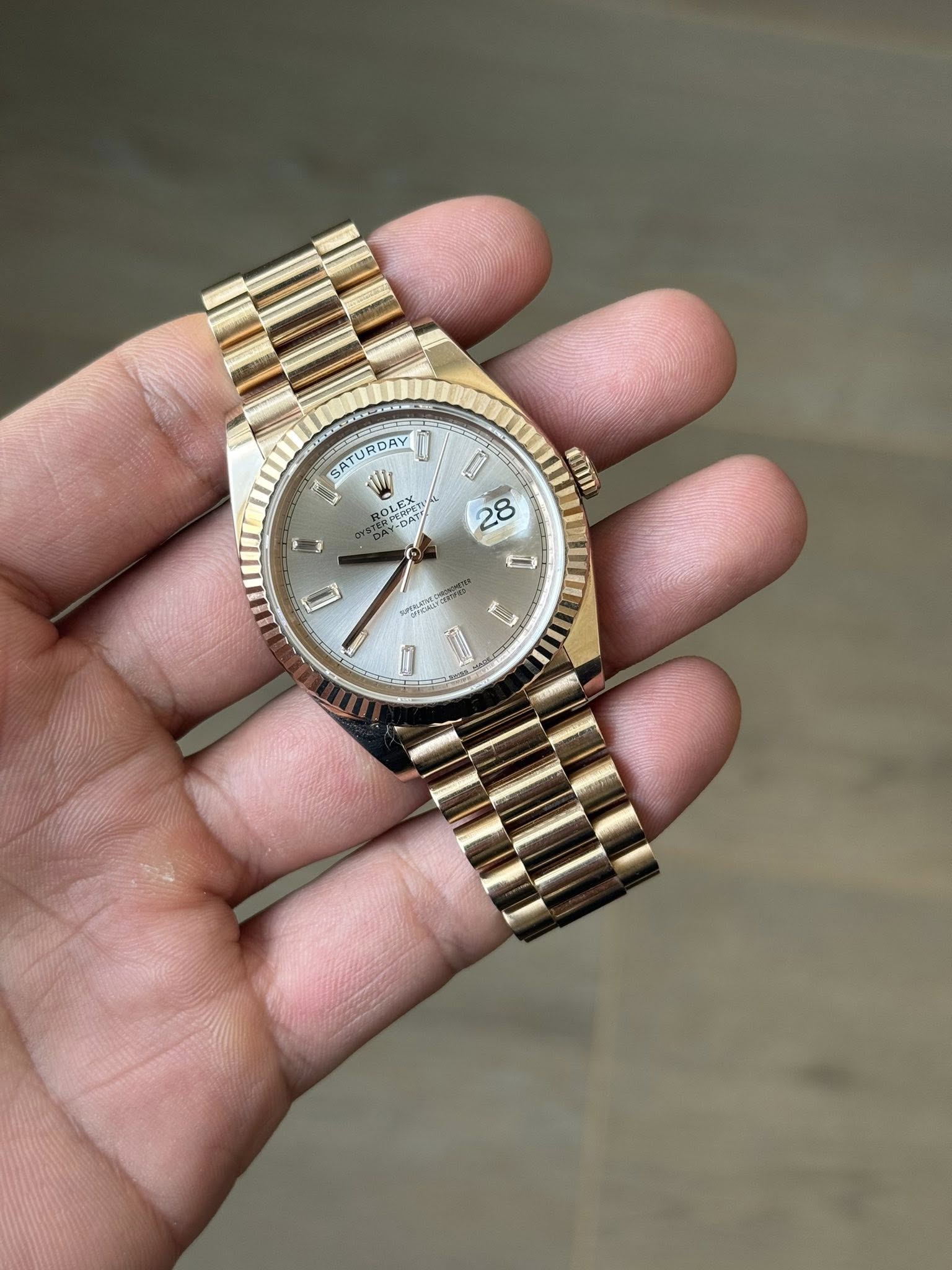 May be an image of wrist watch and text